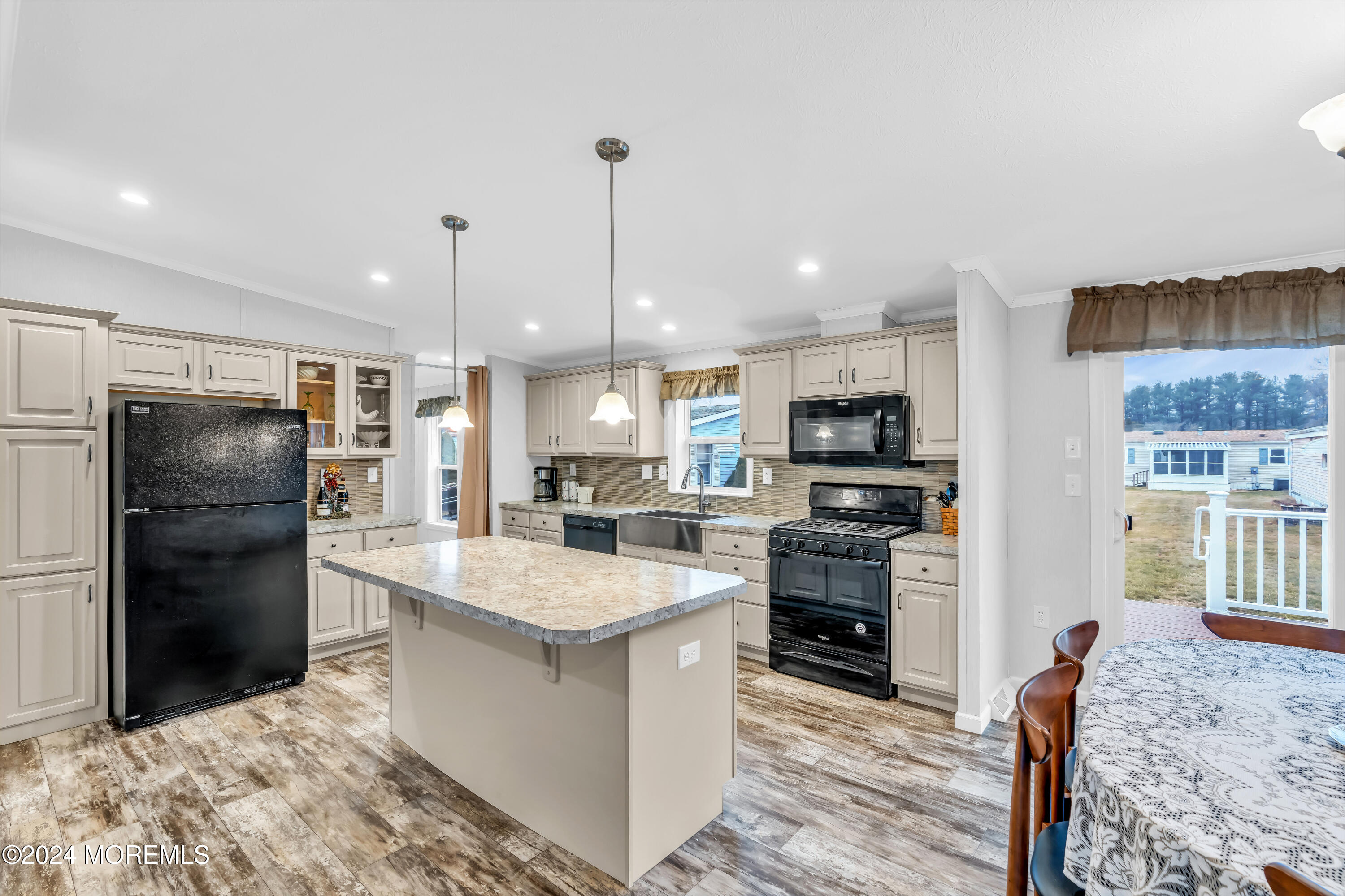 602 Jerome Place Freehold, NJ 07728 - Photo 21 of 55 a large kitchen with stainless steel appliances kitchen island sink refrigerator and stove