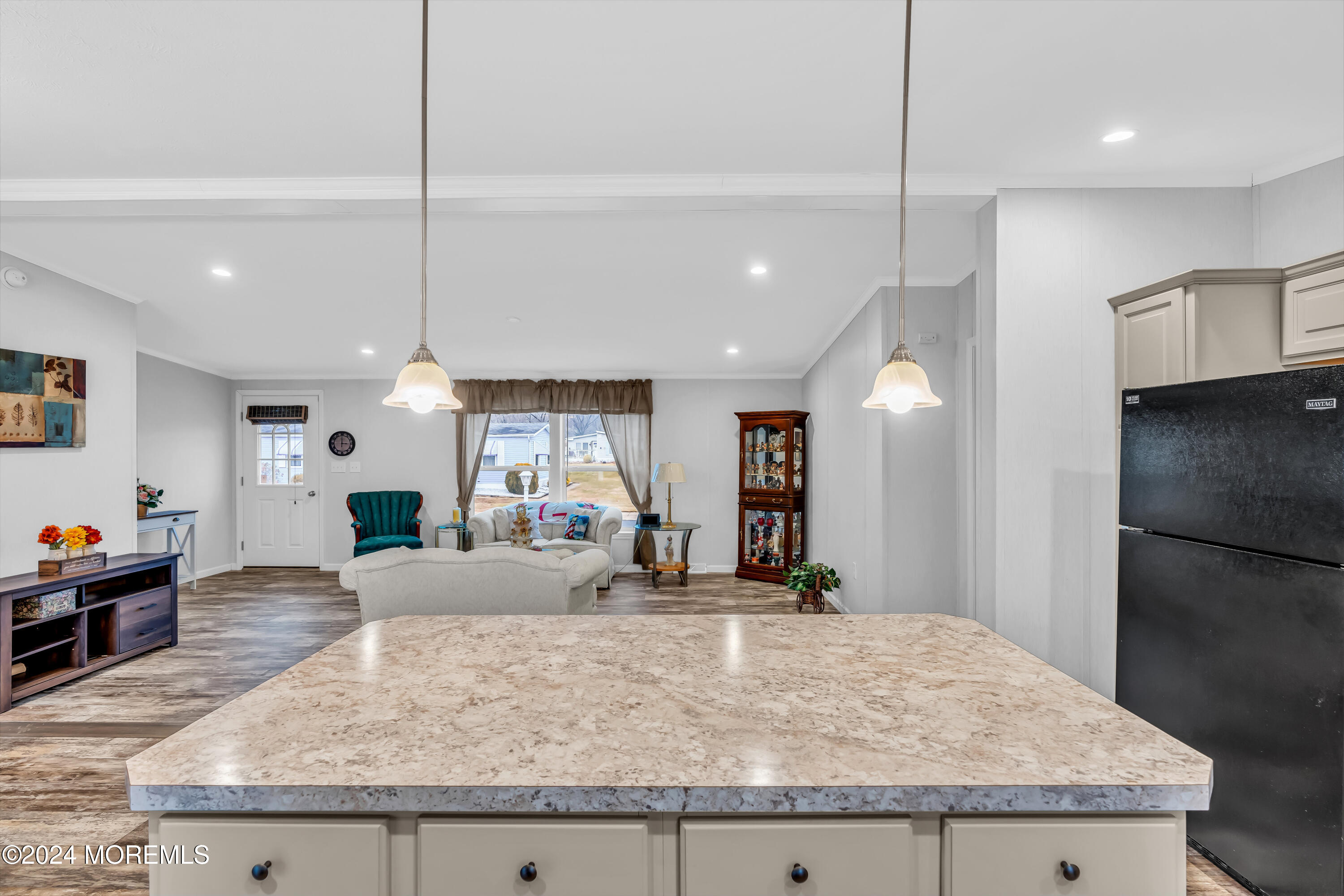 602 Jerome Place Freehold, NJ 07728 - Photo 28 of 55 a large kitchen with kitchen island a counter top space a sink a refrigerator and wooden floor