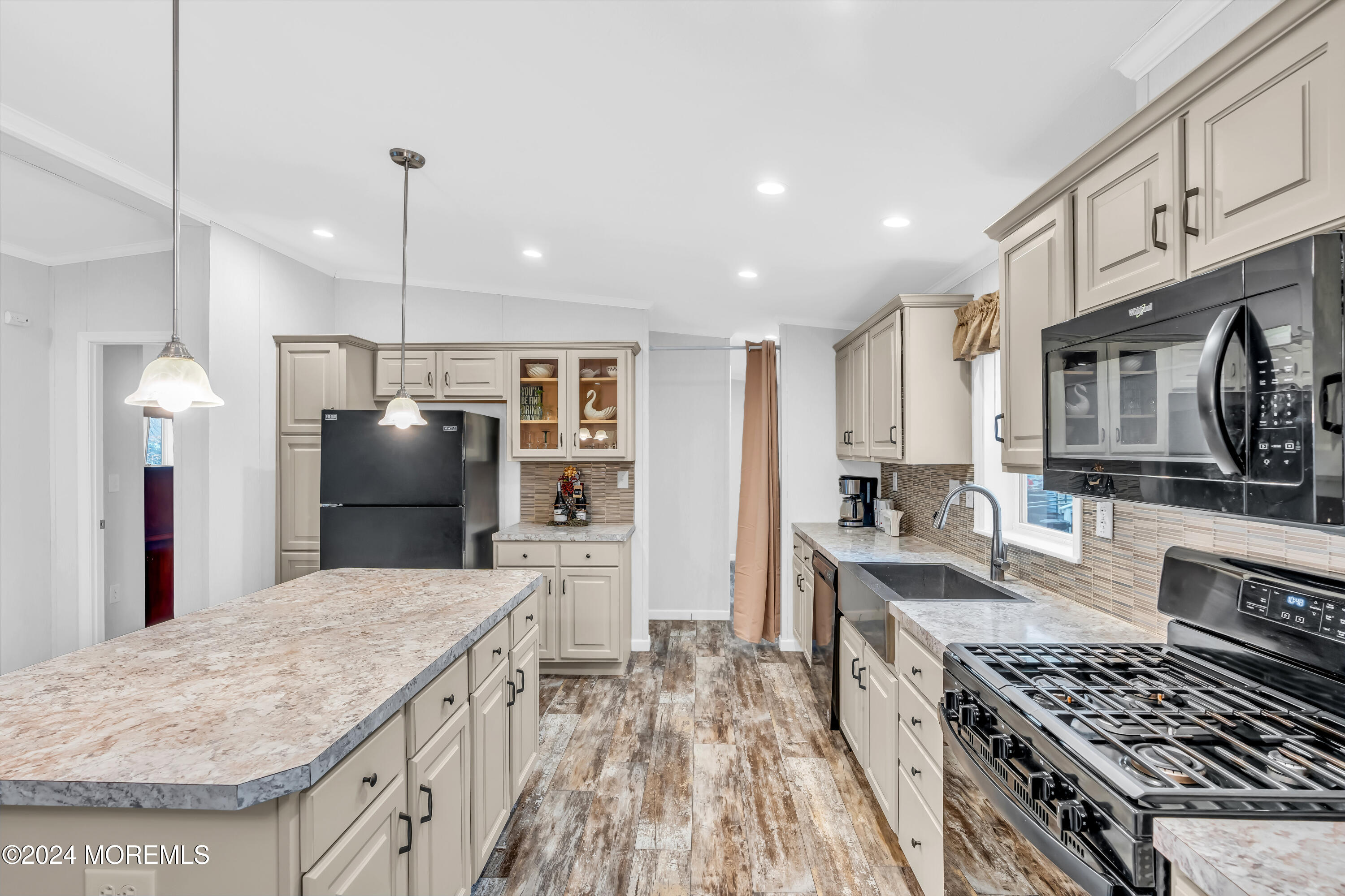 602 Jerome Place Freehold, NJ 07728 - Photo 29 of 55 a kitchen with stainless steel appliances granite countertop a stove top oven a sink a refrigerator and white cabinets