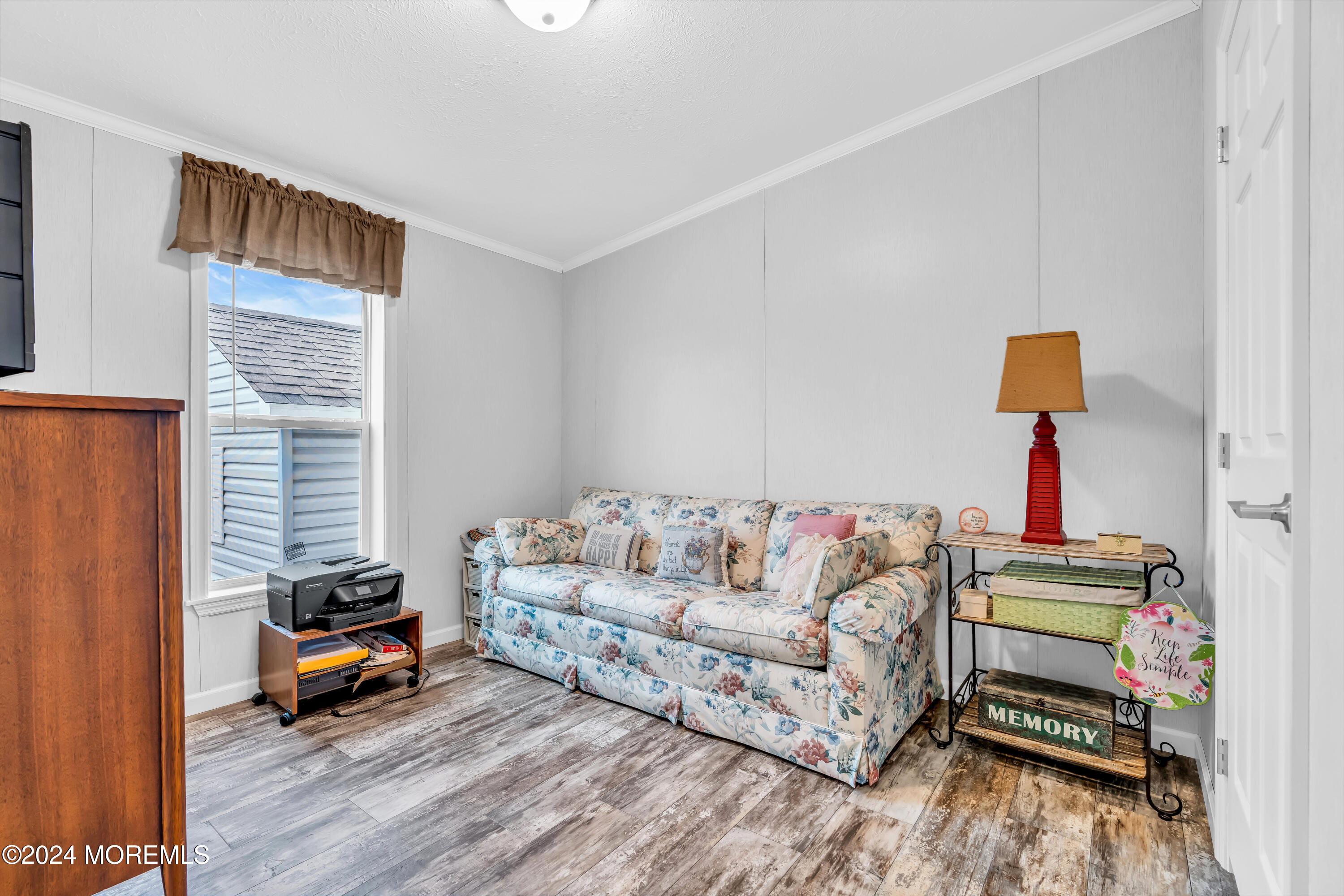 602 Jerome Place Freehold, NJ 07728 - Photo 31 of 55 a living room with furniture and a wooden floor