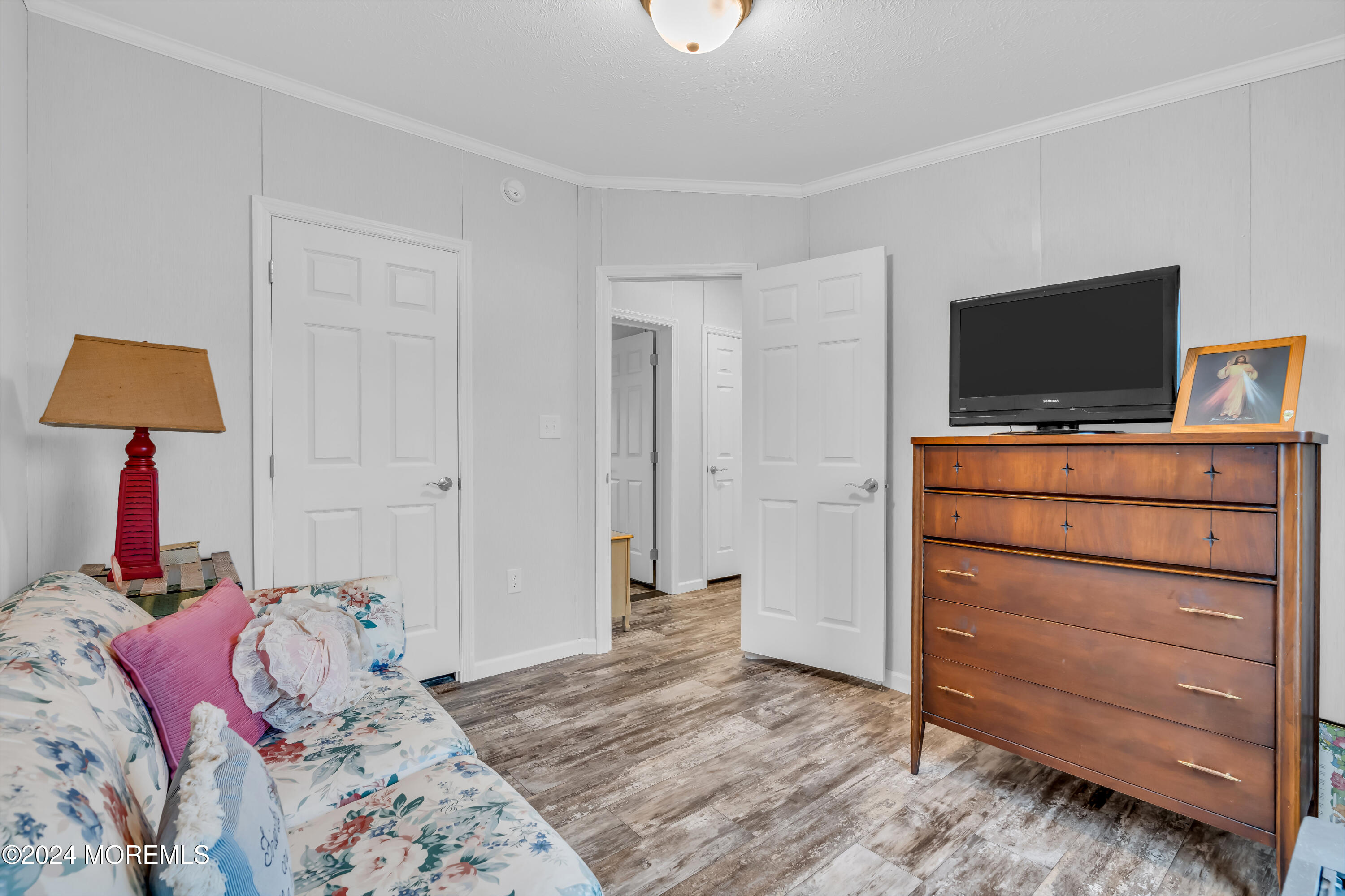 602 Jerome Place Freehold, NJ 07728 - Photo 32 of 55 a bedroom with a bed and a flat screen television