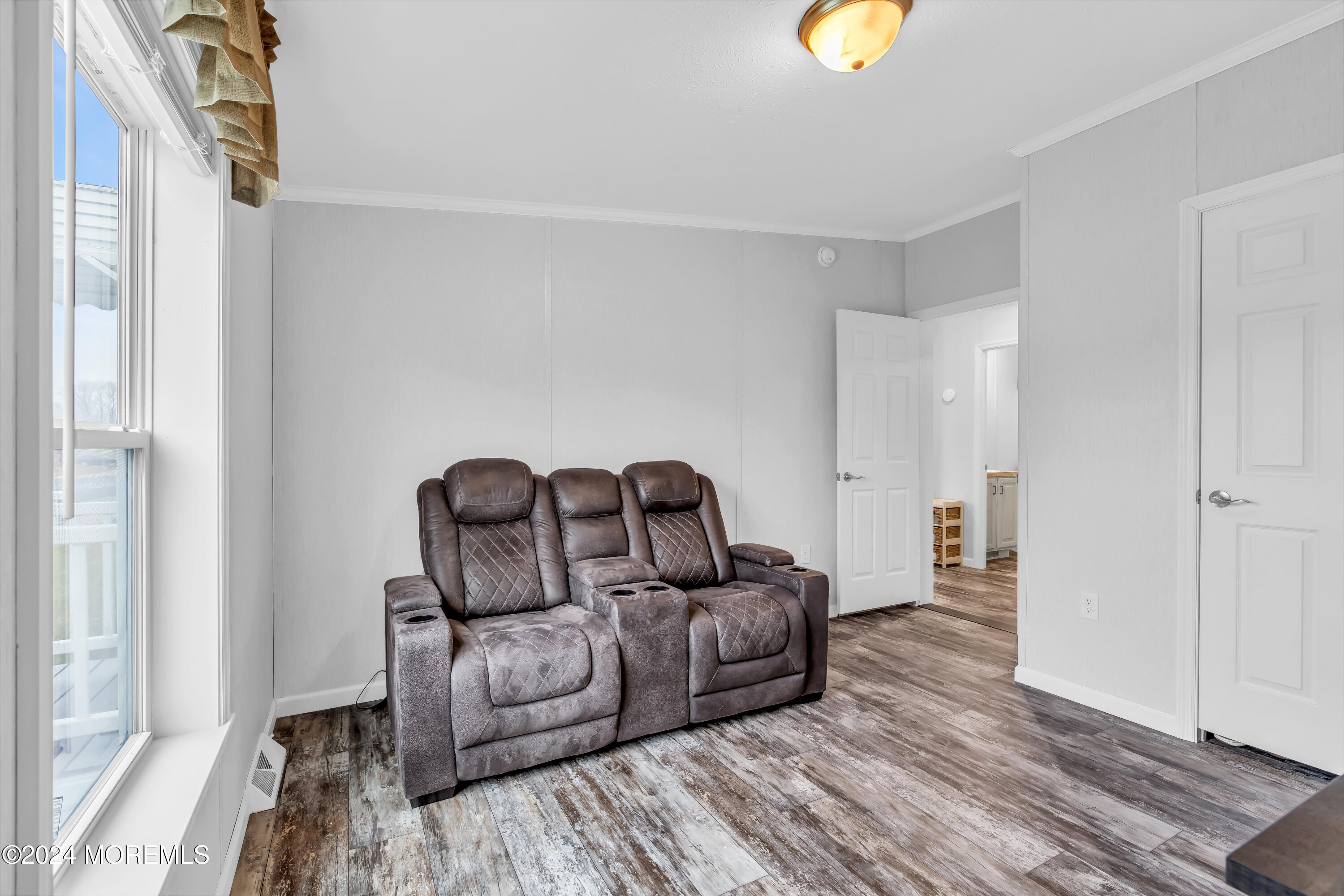 602 Jerome Place Freehold, NJ 07728 - Photo 37 of 55 a living room with furniture and a lamp