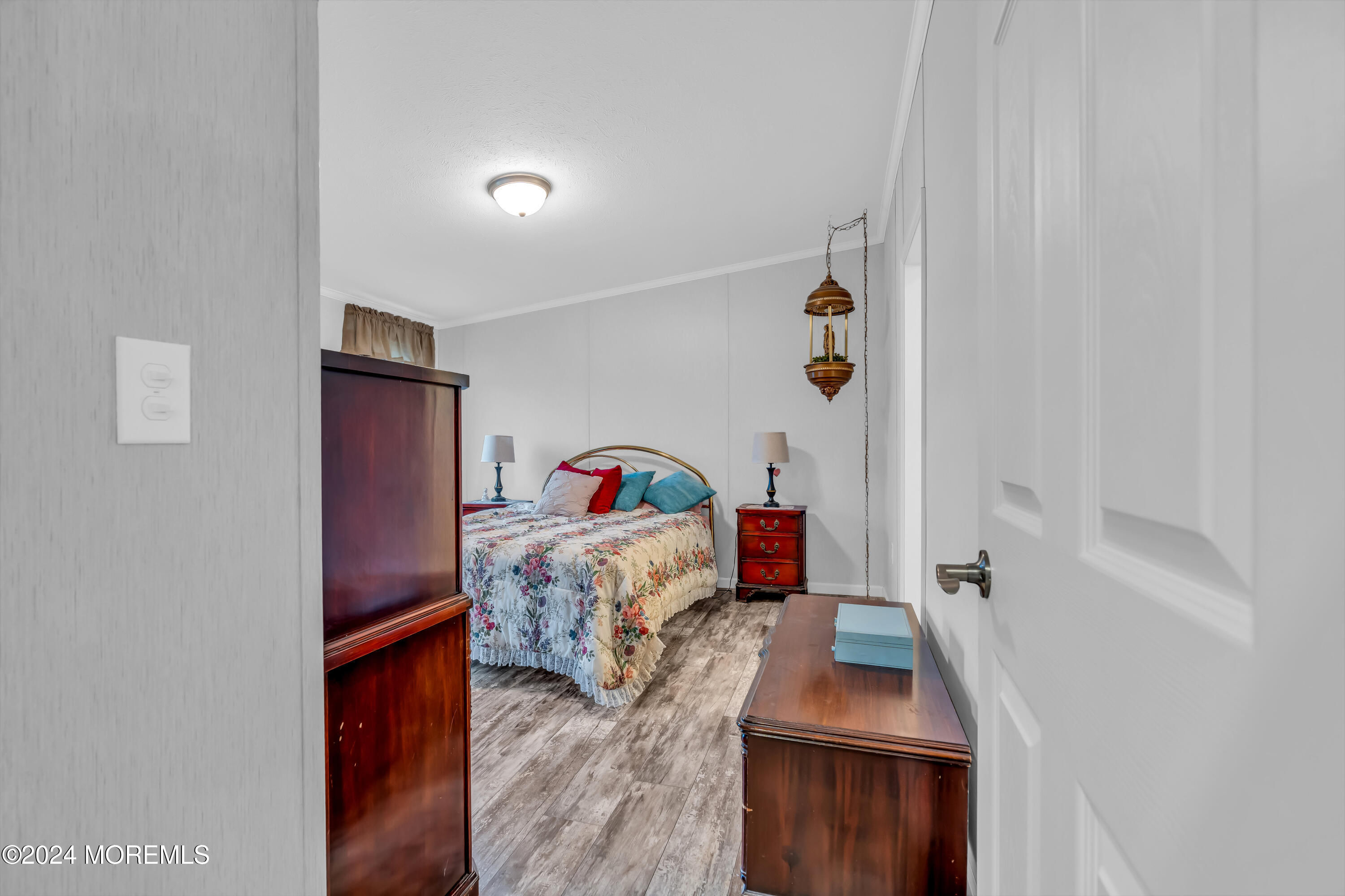 602 Jerome Place Freehold, NJ 07728 - Photo 38 of 55 a bedroom with a bed and a flat tv screen on the dresser