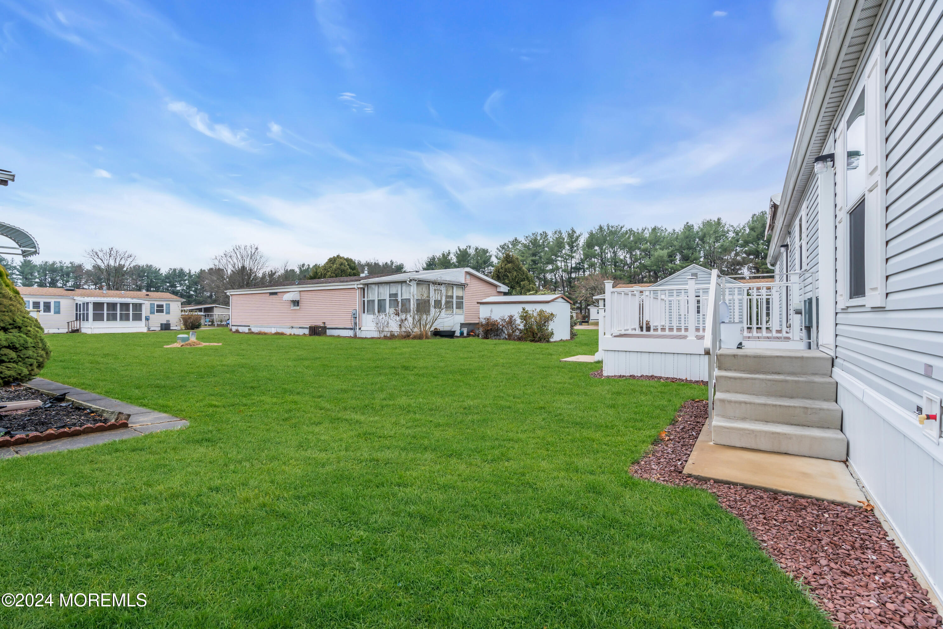 602 Jerome Place Freehold, NJ 07728 - Photo 50 of 55 a view of a house with a yard porch and sitting area