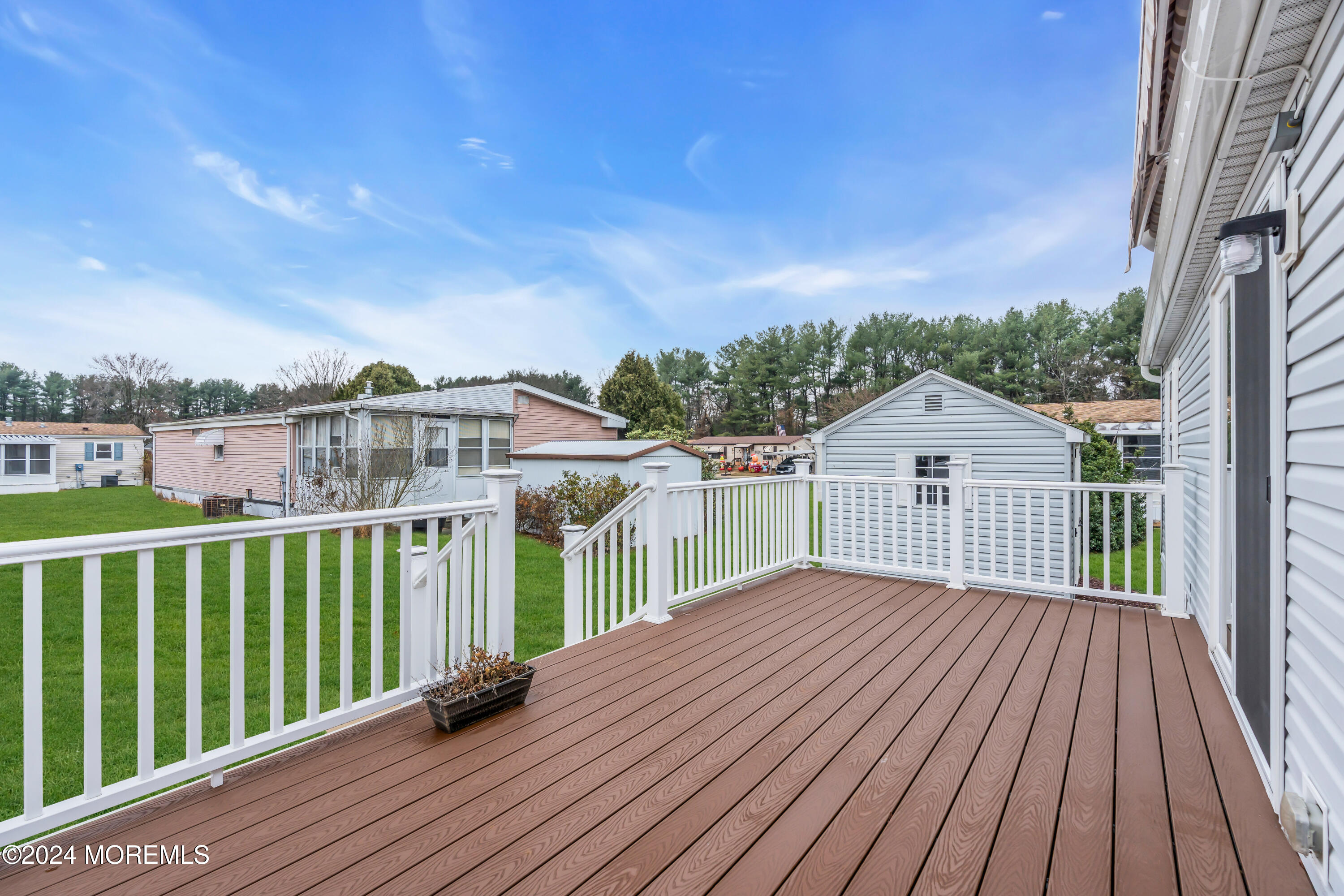 602 Jerome Place Freehold, NJ 07728 - Photo 54 of 55 a view of a house with a wooden deck