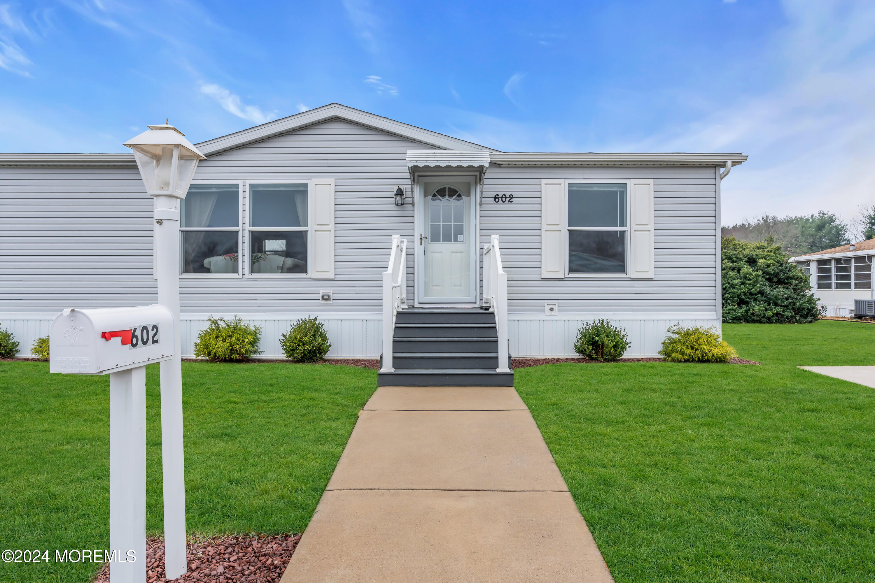 602 Jerome Place Freehold, NJ 07728 - Photo 6 of 55 a front view of a house with garden