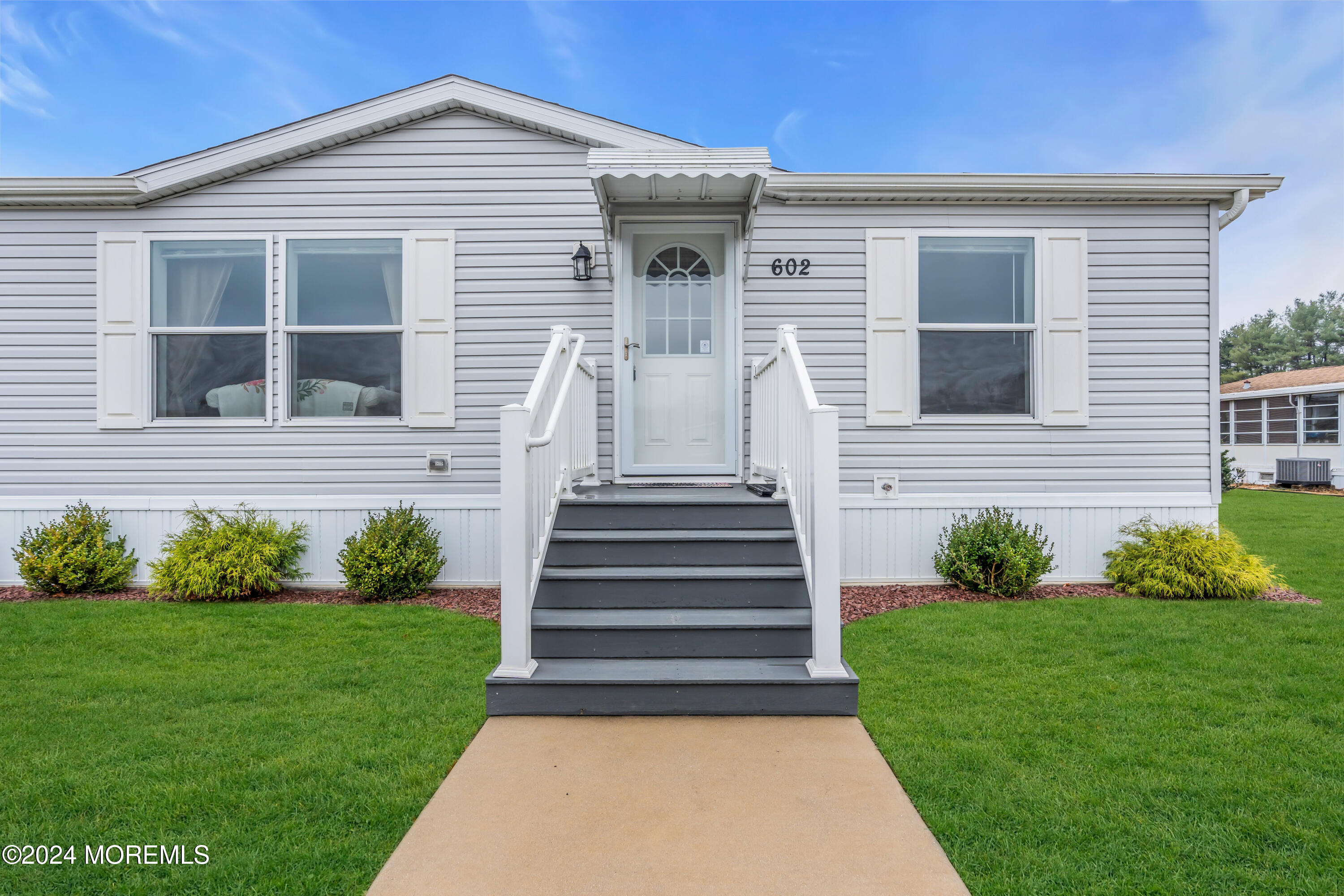602 Jerome Place Freehold, NJ 07728 - Photo 7 of 55 a front view of a house with a yard