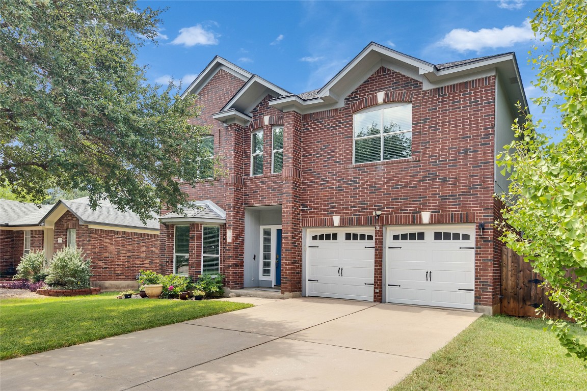 8507 Chat Lane Round Rock, TX 78681 - Photo 1 of 1 a front view of a house with a yard and garage
