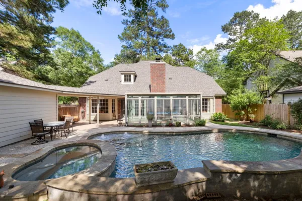 a view of a swimming pool with a patio