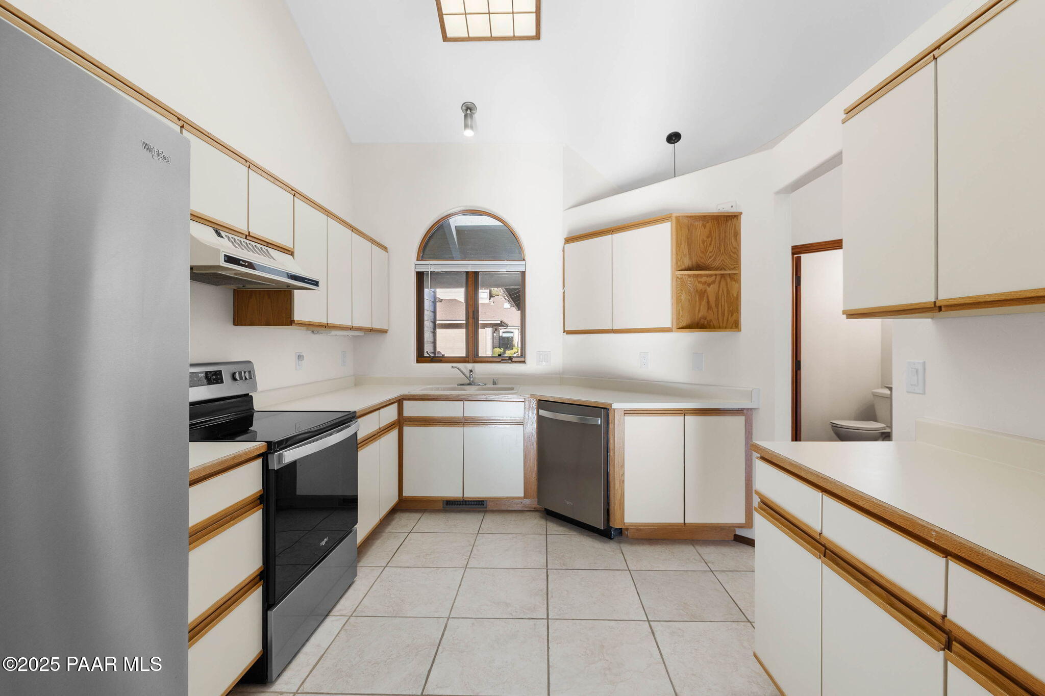 1219 Timber Point North Prescott, AZ 86303 - Photo 15 of 38 a kitchen with granite countertop a sink stainless steel appliances and cabinets