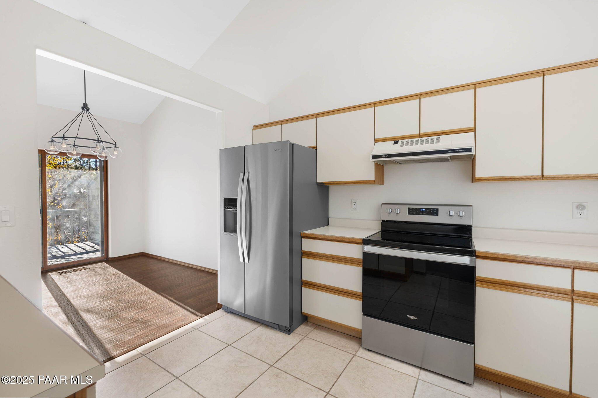 1219 Timber Point North Prescott, AZ 86303 - Photo 16 of 38 a kitchen with stainless steel appliances granite countertop a refrigerator and a stove top oven