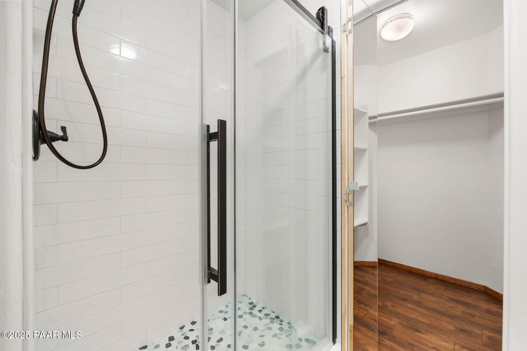 1219 Timber Point North Prescott, AZ 86303 - Photo 24 of 38 a view of a hallway with wooden floor and a bathroom