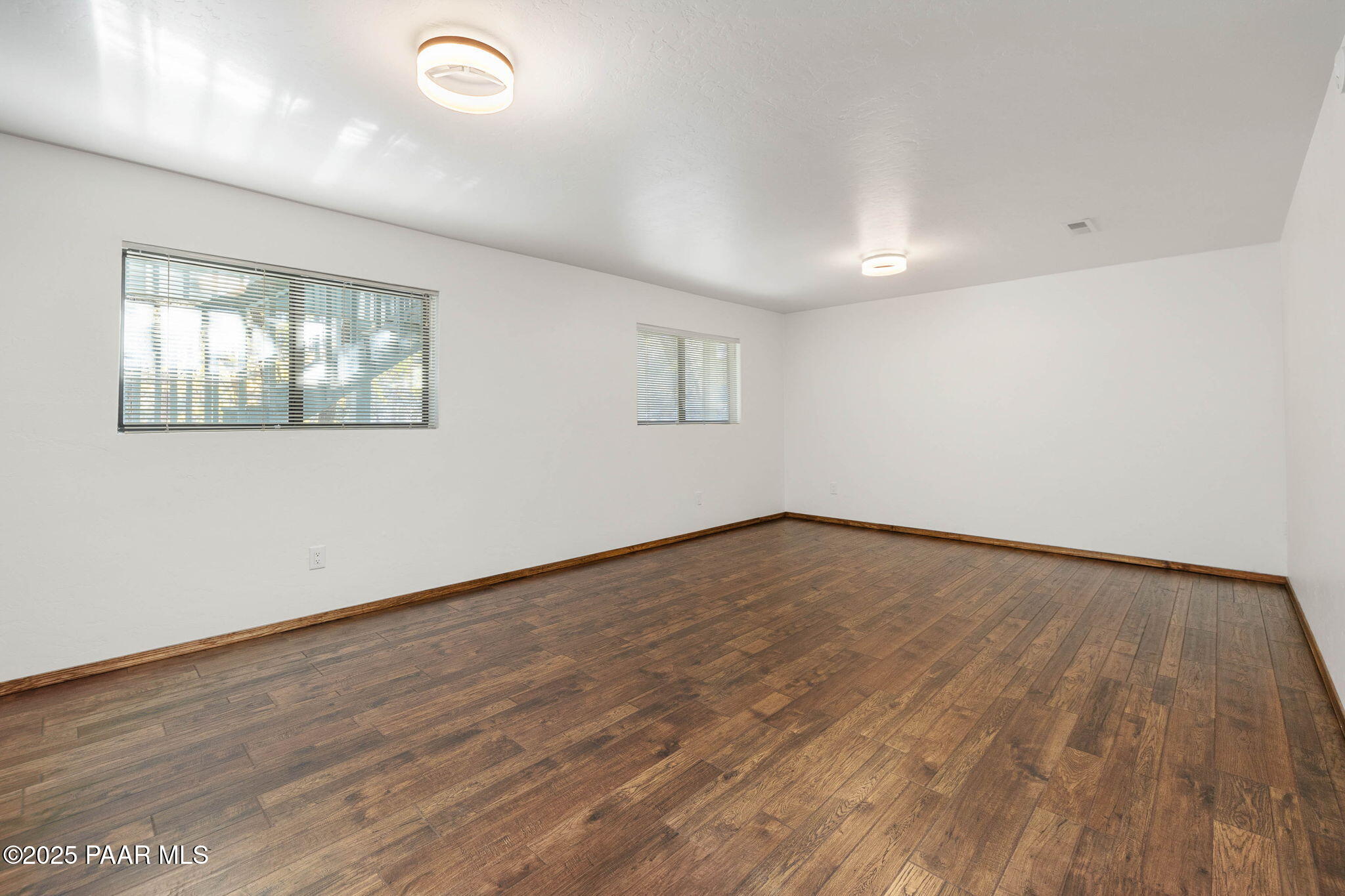 1219 Timber Point North Prescott, AZ 86303 - Photo 25 of 38 an empty room with wooden floor and windows