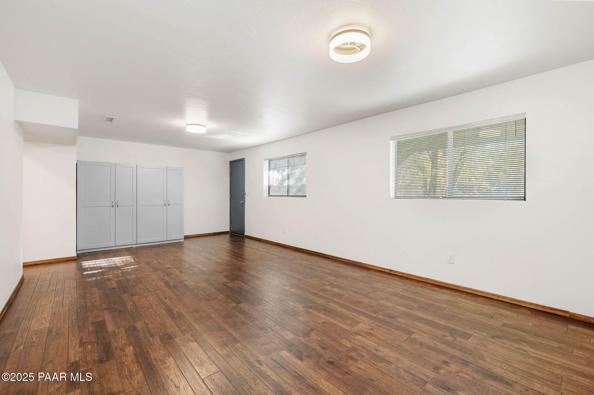 1219 Timber Point North Prescott, AZ 86303 - Photo 28 of 38 a view of an empty room with wooden floor and a window