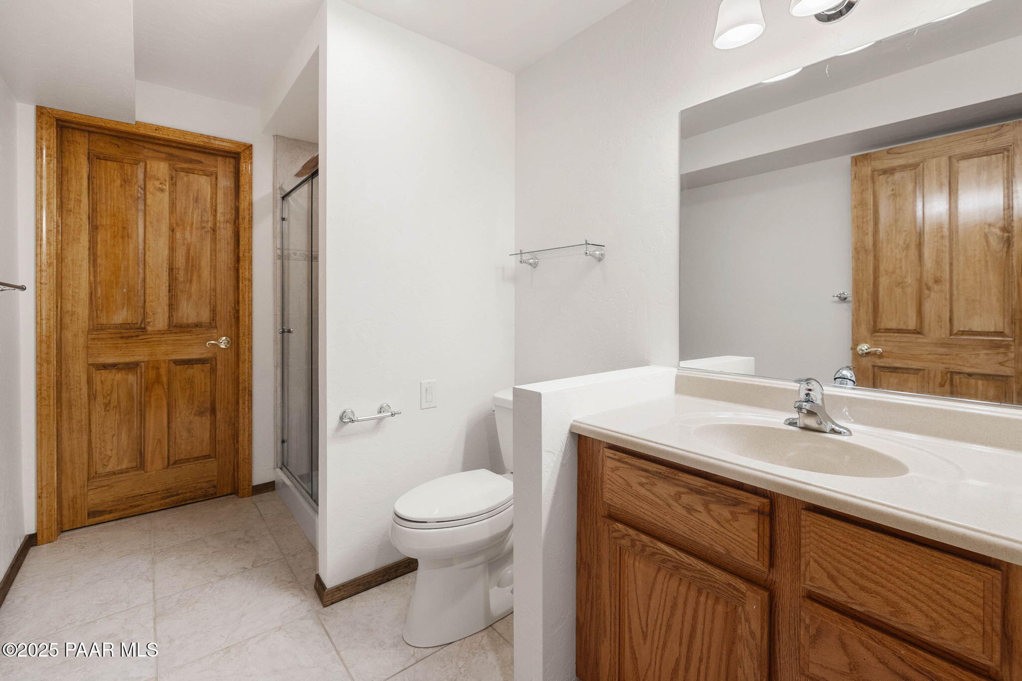 1219 Timber Point North Prescott, AZ 86303 - Photo 29 of 38 a bathroom with a sink a toilet and shower