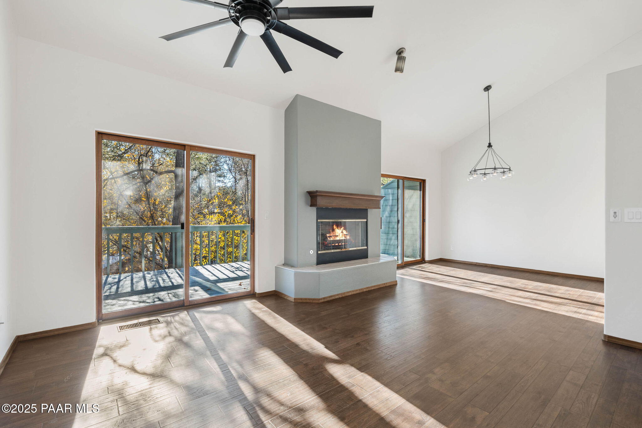 1219 Timber Point North Prescott, AZ 86303 - Photo 9 of 38 a view of an empty room with a fireplace and a window