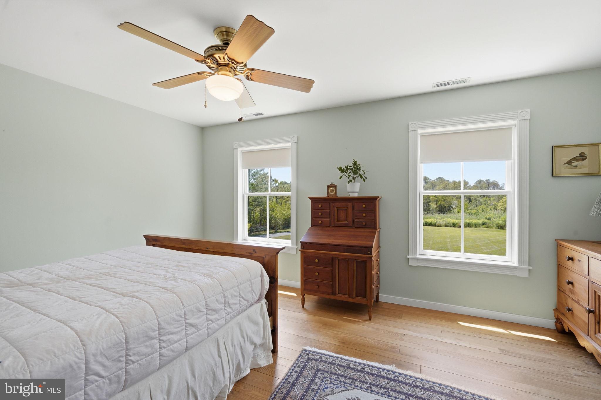 26226 Langs Landing Road Oxford, MD 21654 - Photo 26 of 48 a bedroom with a bed and a window