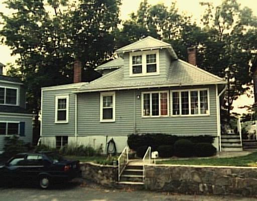 14 Rocky Point Road Norwalk, CT 06853 - Photo 1 of 1 a front view of a house with a yard