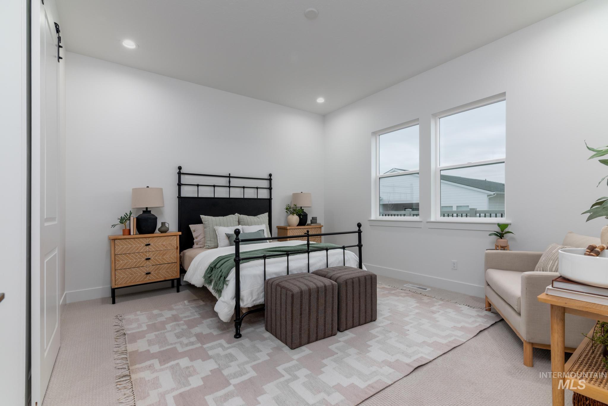 8629 West Stillmore Street Star, ID 83669 - Photo 16 of 27 Bedroom featuring light carpet and recessed lighting