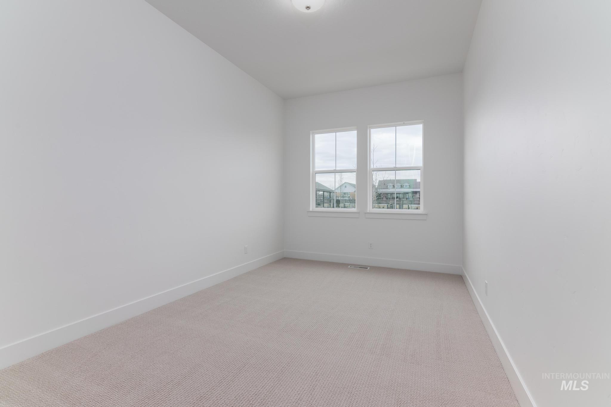 8629 West Stillmore Street Star, ID 83669 - Photo 20 of 27 Spare room featuring light colored carpet and baseboards