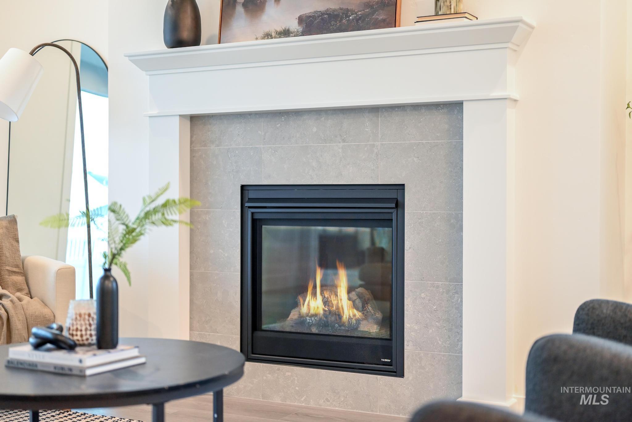 8629 West Stillmore Street Star, ID 83669 - Photo 7 of 27 Detailed view of a fireplace and wood finished floors