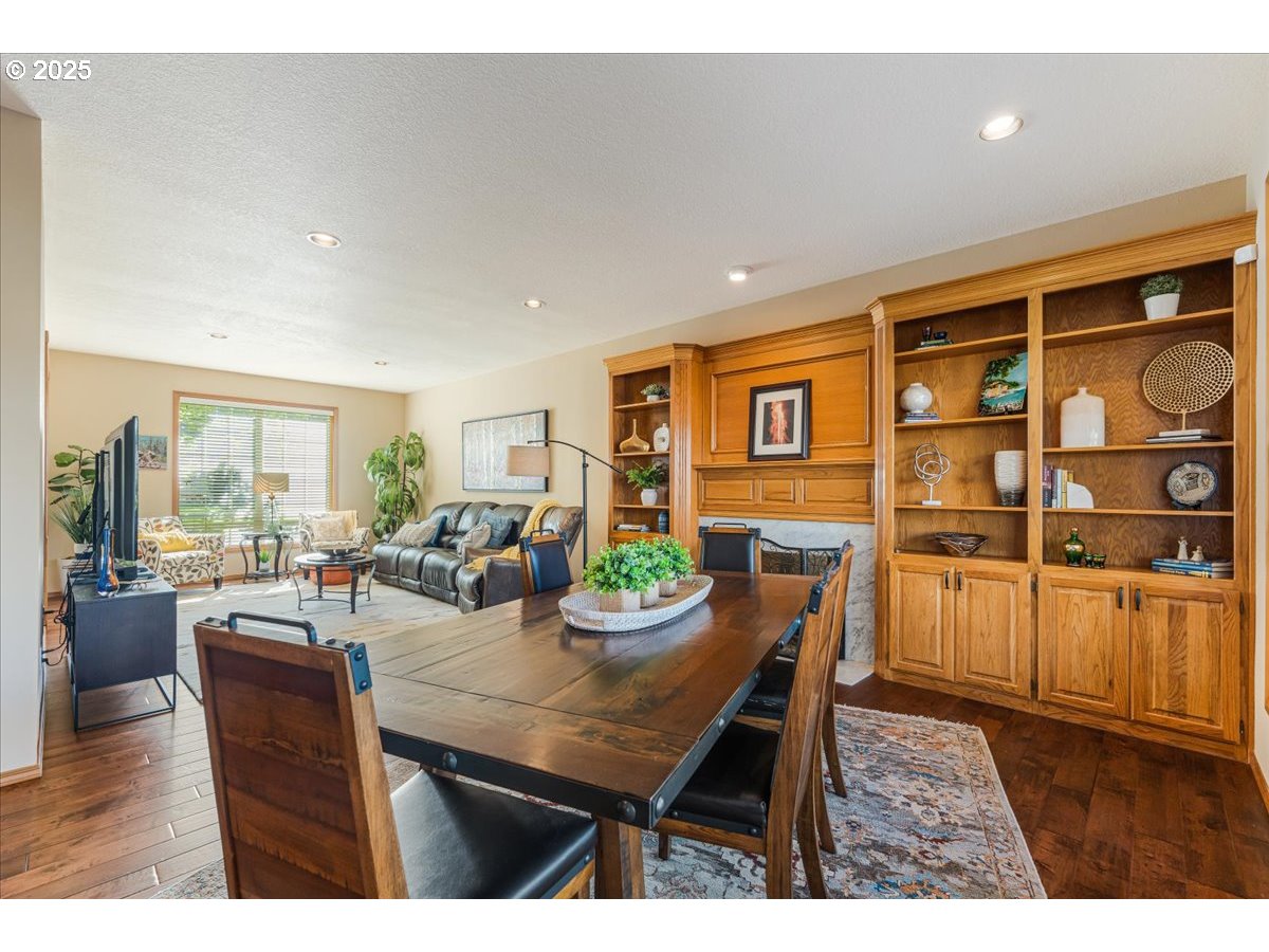 16706 Northwest Waterford Way Portland, OR 97229 - Photo 14 of 45 a view of a dining room with furniture window and wooden floor