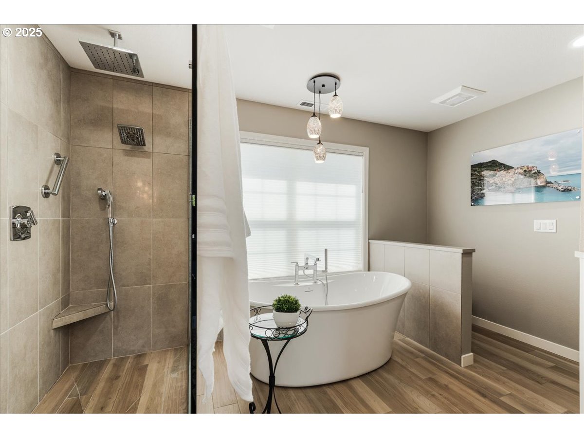 16706 Northwest Waterford Way Portland, OR 97229 - Photo 29 of 45 a living room with a couch and a table