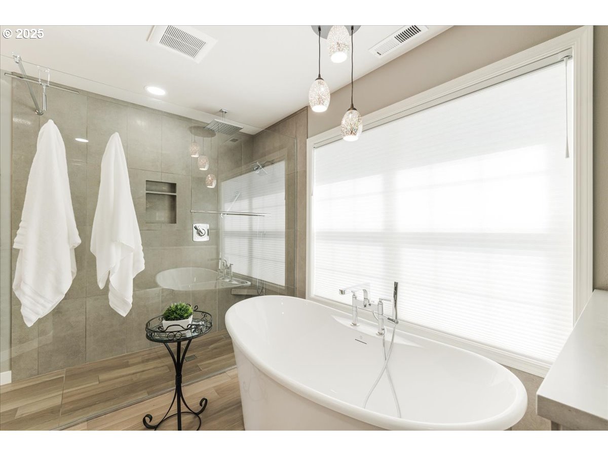 16706 Northwest Waterford Way Portland, OR 97229 - Photo 30 of 45 a bathroom with a sink and a mirror