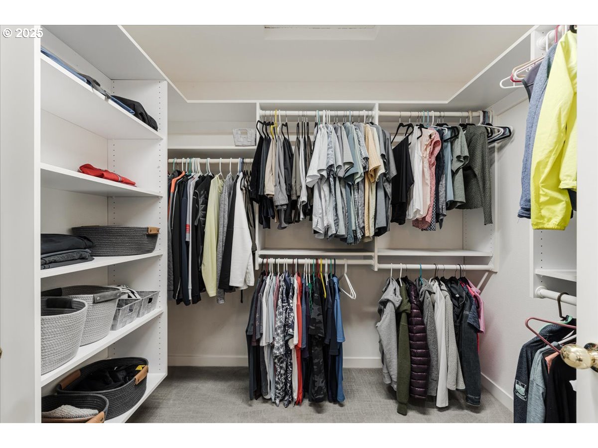 16706 Northwest Waterford Way Portland, OR 97229 - Photo 31 of 45 a view of walk in closet with clothes and shoes