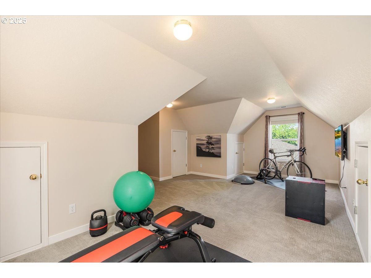 16706 Northwest Waterford Way Portland, OR 97229 - Photo 36 of 45 a living room with furniture a large window and gym equipment