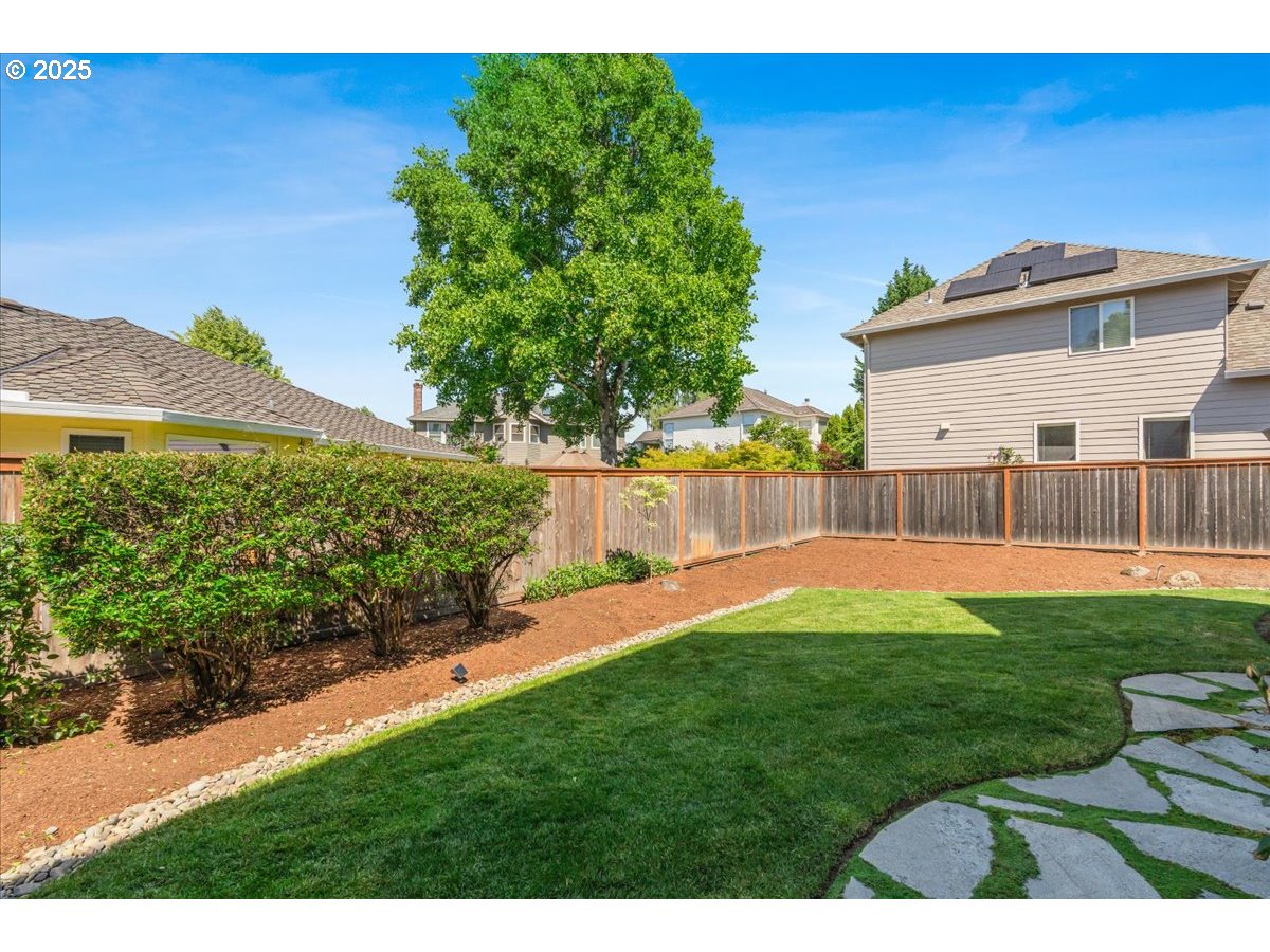 16706 Northwest Waterford Way Portland, OR 97229 - Photo 40 of 45 a view of a backyard with a garden and plants