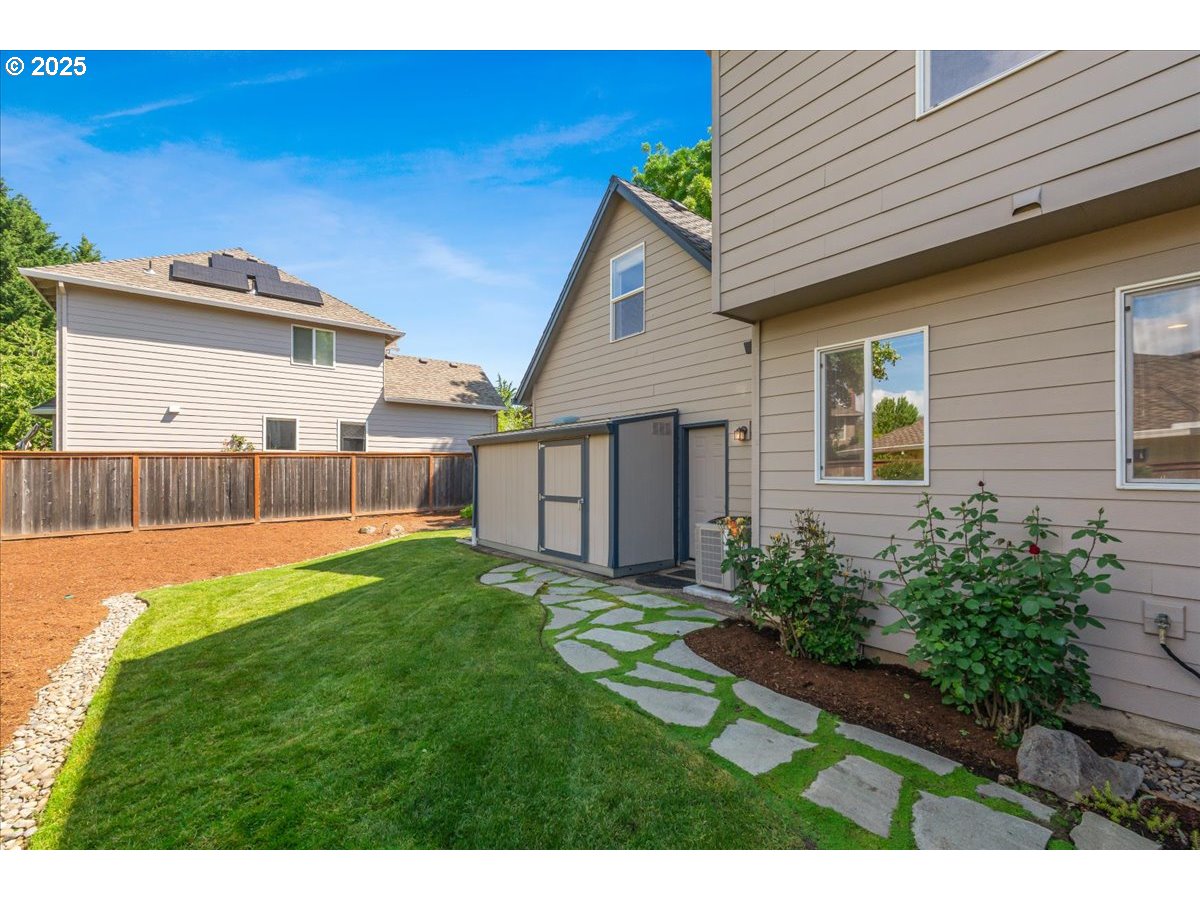 16706 Northwest Waterford Way Portland, OR 97229 - Photo 42 of 45 a view of a house with a yard and sitting area