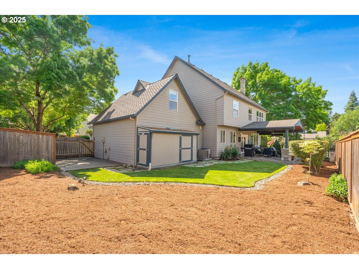 16706 Northwest Waterford Way Portland, OR 97229 - Photo 44 of 45 a view of a house with a yard and sitting area