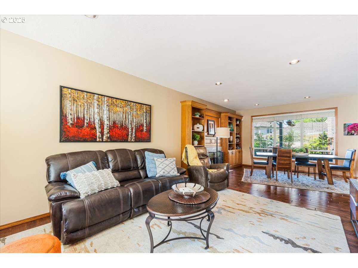 16706 Northwest Waterford Way Portland, OR 97229 - Photo 9 of 45 a living room with furniture and a large window