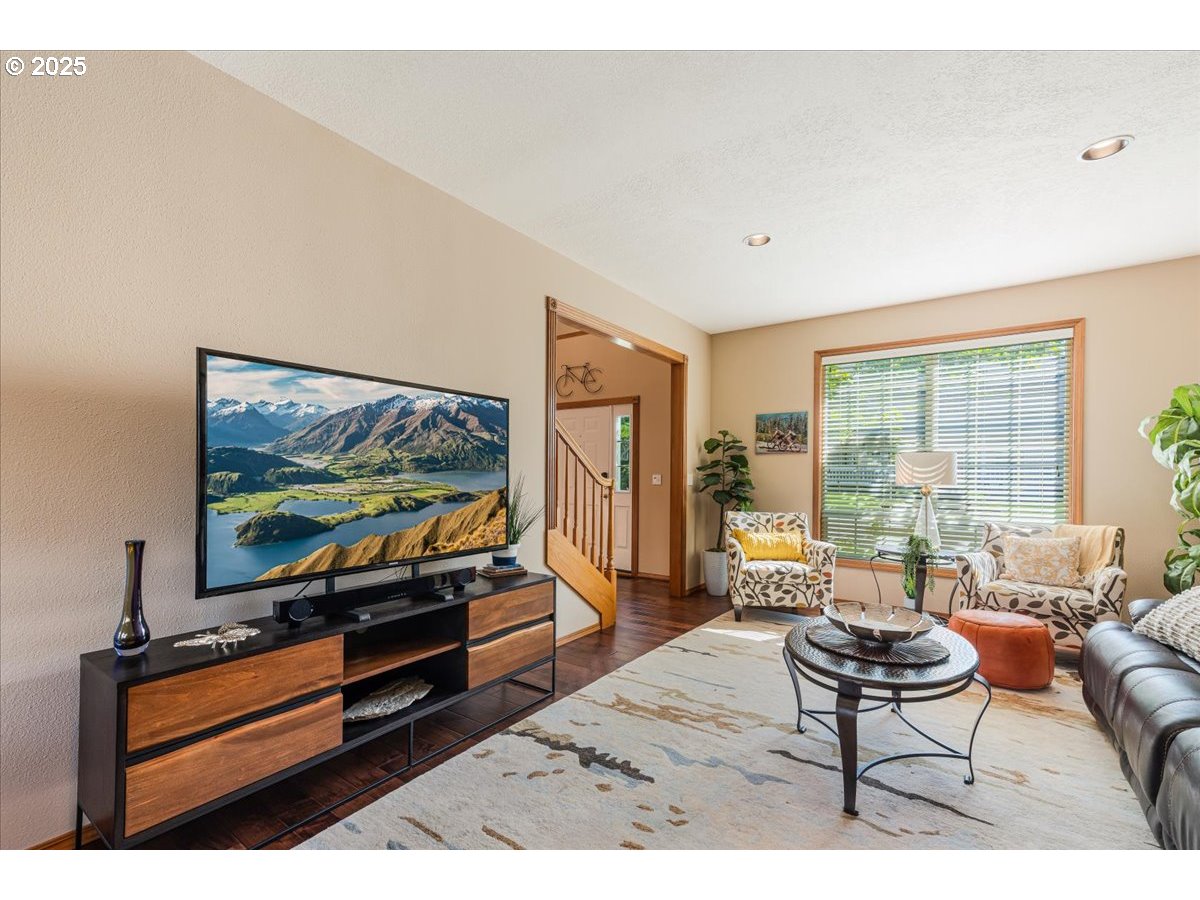 16706 Northwest Waterford Way Portland, OR 97229 - Photo 10 of 45 a living room with furniture and a flat screen tv