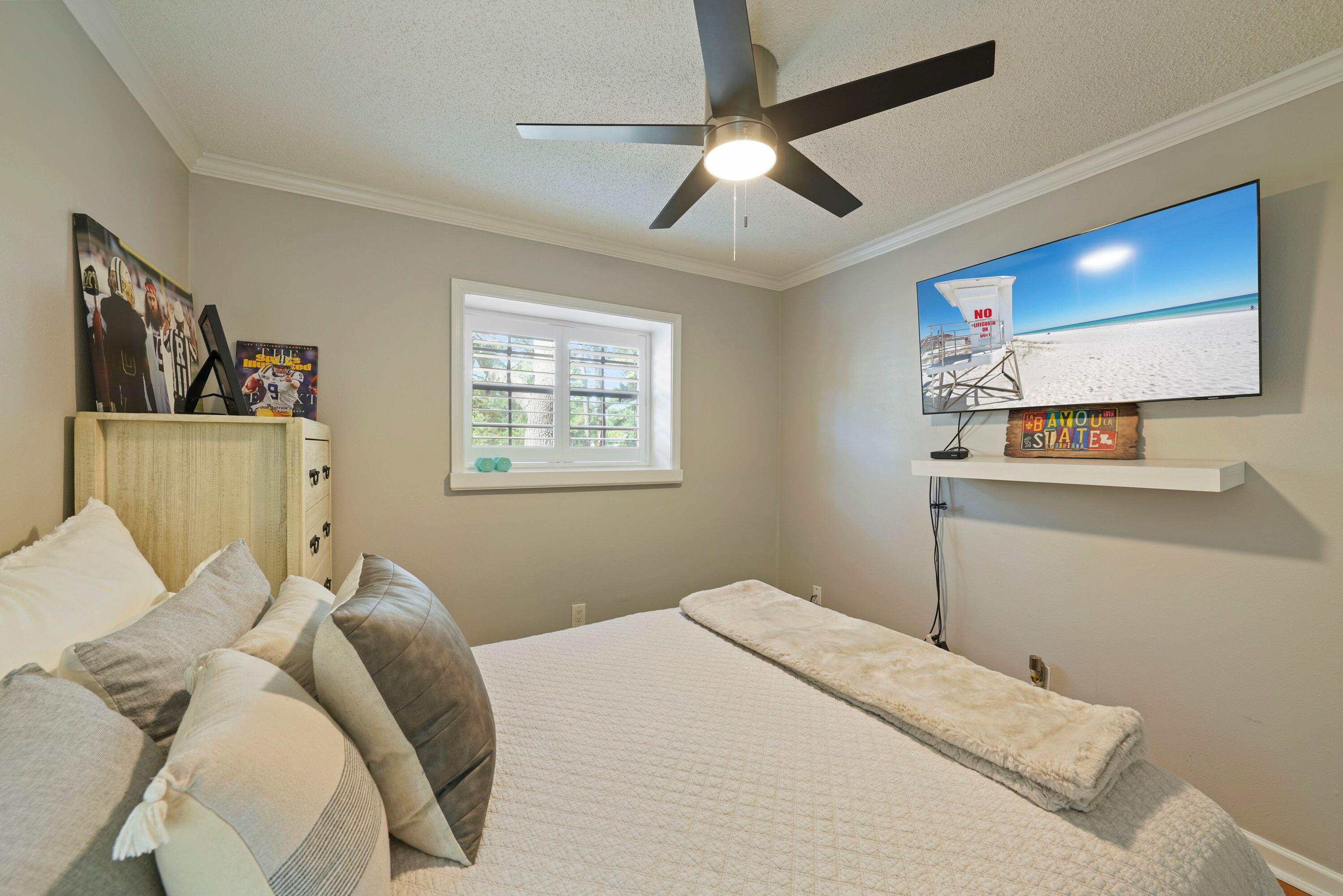 283 Sunset Bay, Unit 28B Miramar Beach, FL 32550 - Photo 18 of 23 a bedroom with a bed and a painting on the wall