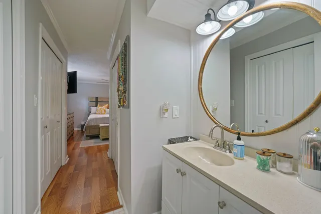 a en suite bathroom with a sink and a mirror