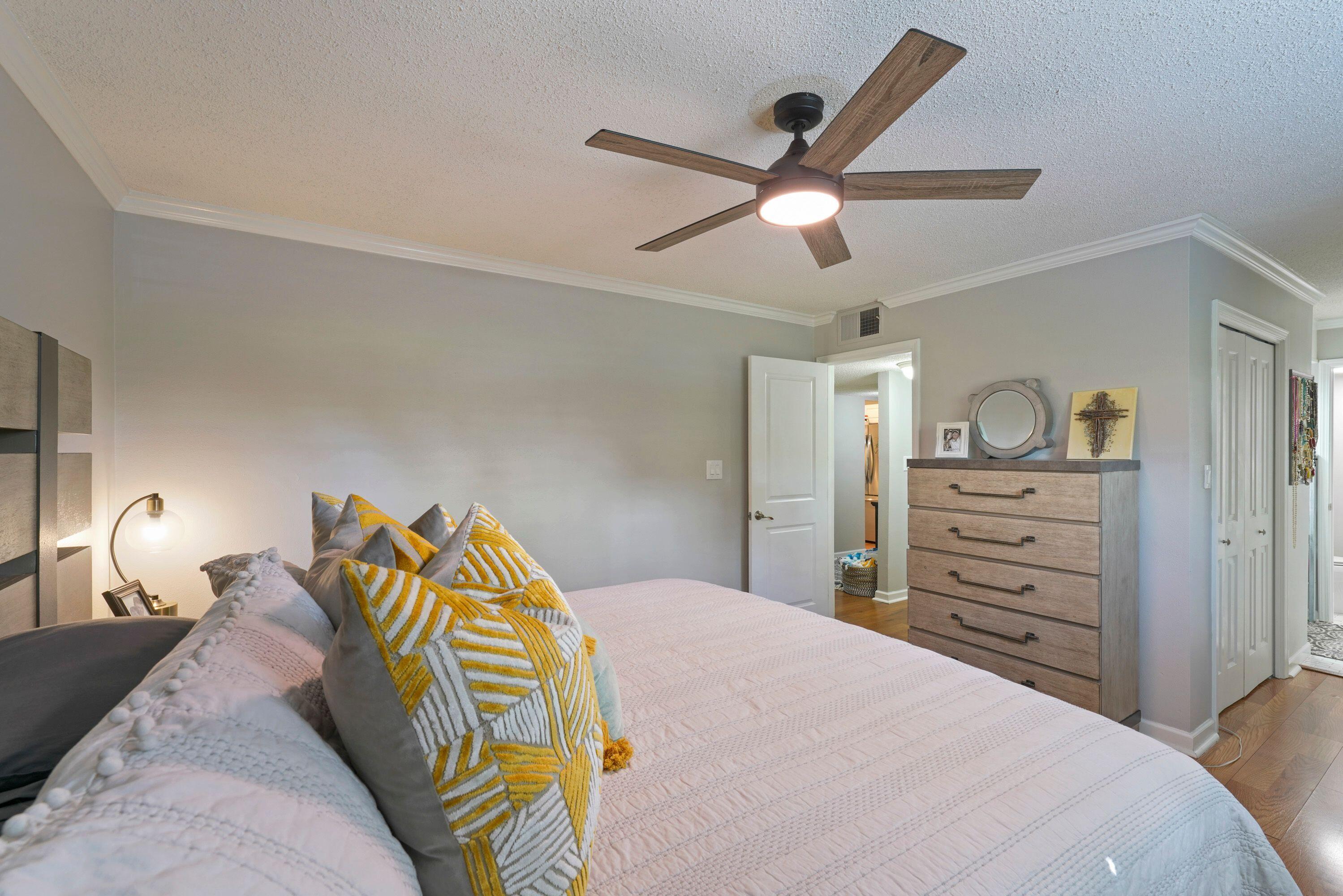 283 Sunset Bay, Unit 28B Miramar Beach, FL 32550 - Photo 22 of 23 a bedroom with a bed and a chandelier