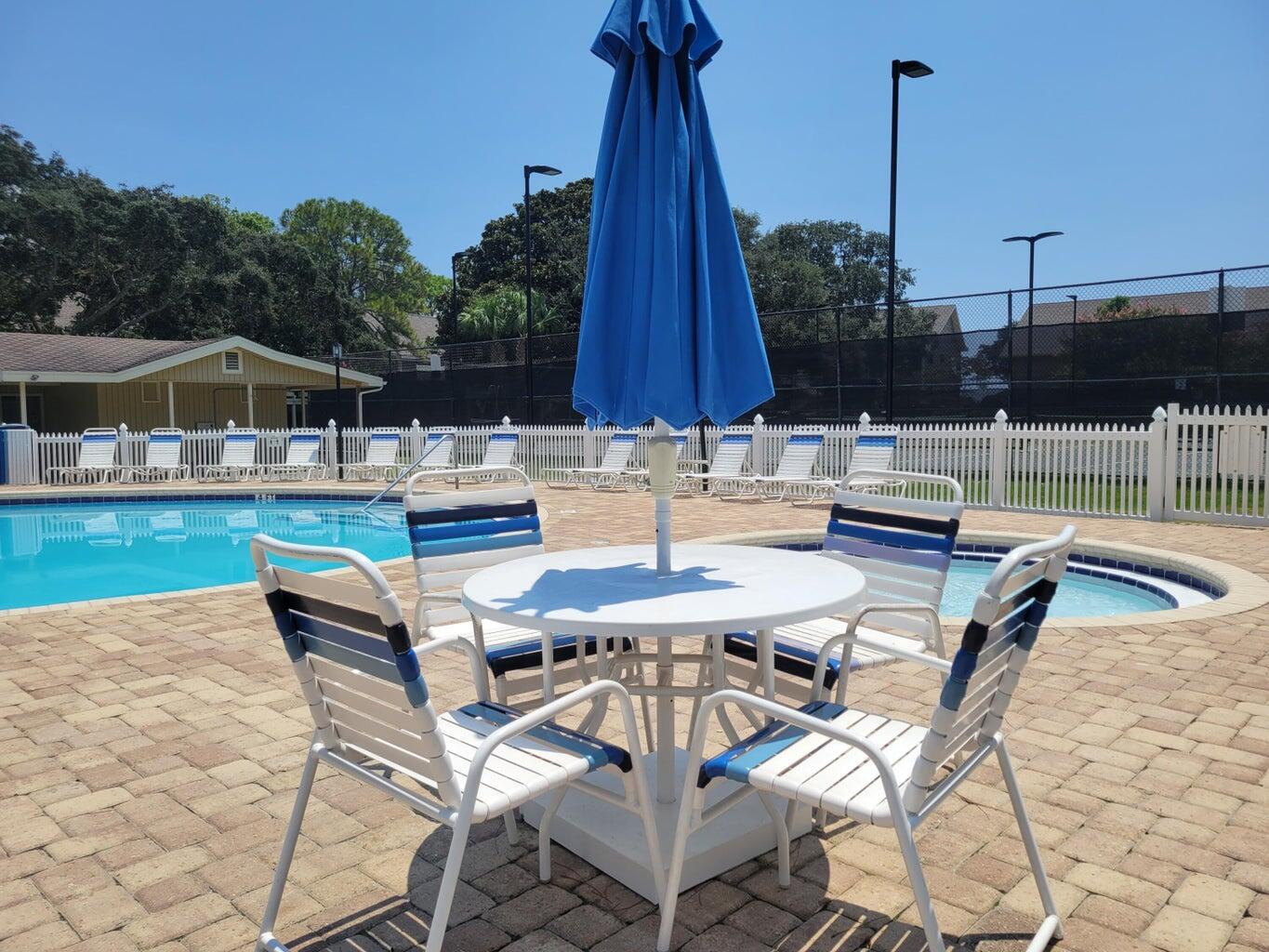 283 Sunset Bay, Unit 28B Miramar Beach, FL 32550 - Photo 4 of 23 a patio with a table and chairs