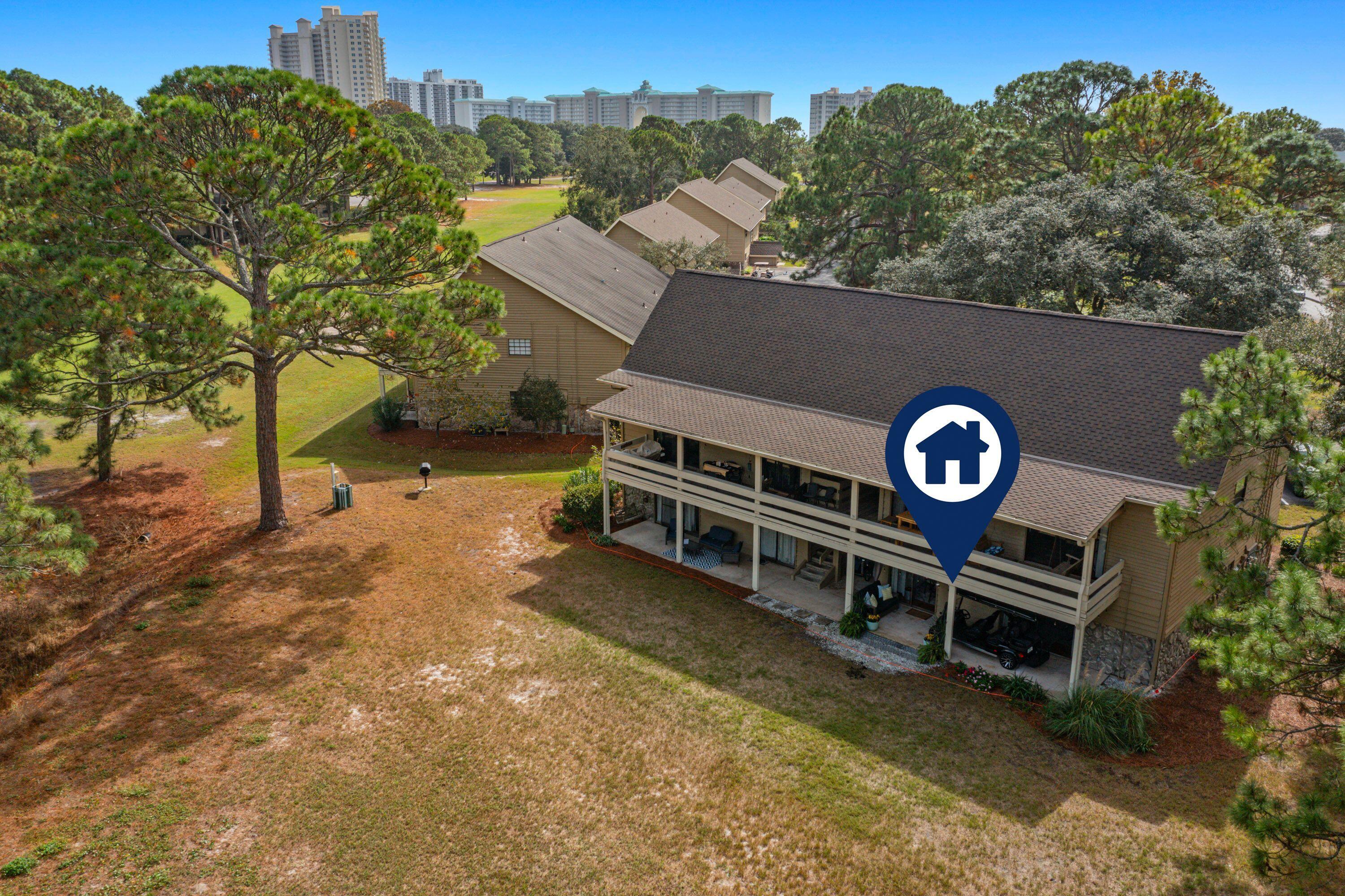 283 Sunset Bay, Unit 28B Miramar Beach, FL 32550 - Photo 9 of 23 a view of a wooden house with a yard and furniture