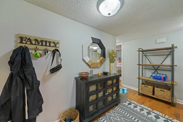 a living room with furniture and a mirror