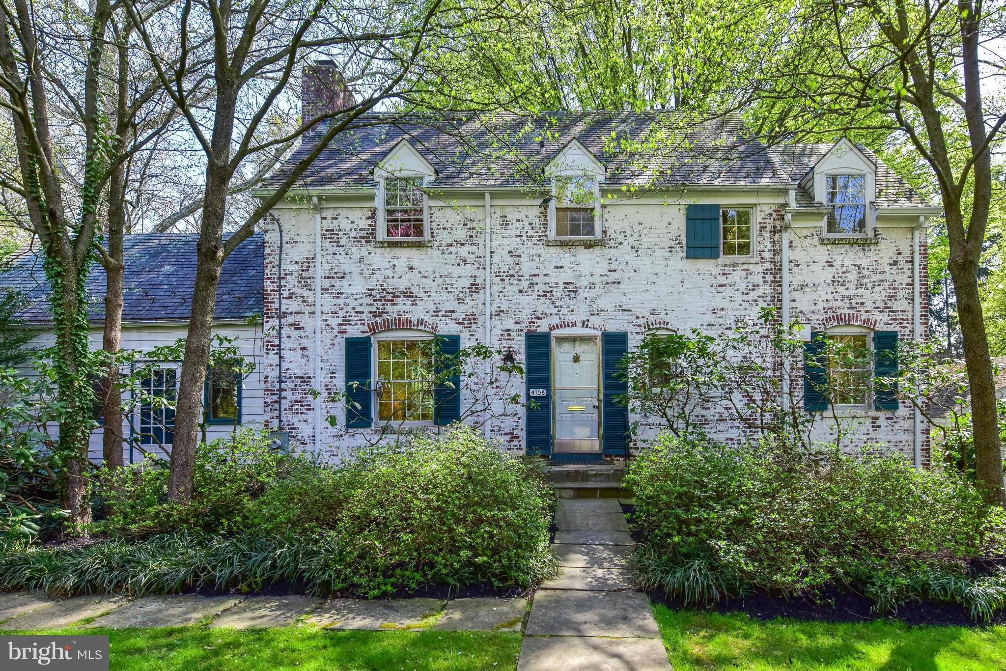 front view of a house with a garden