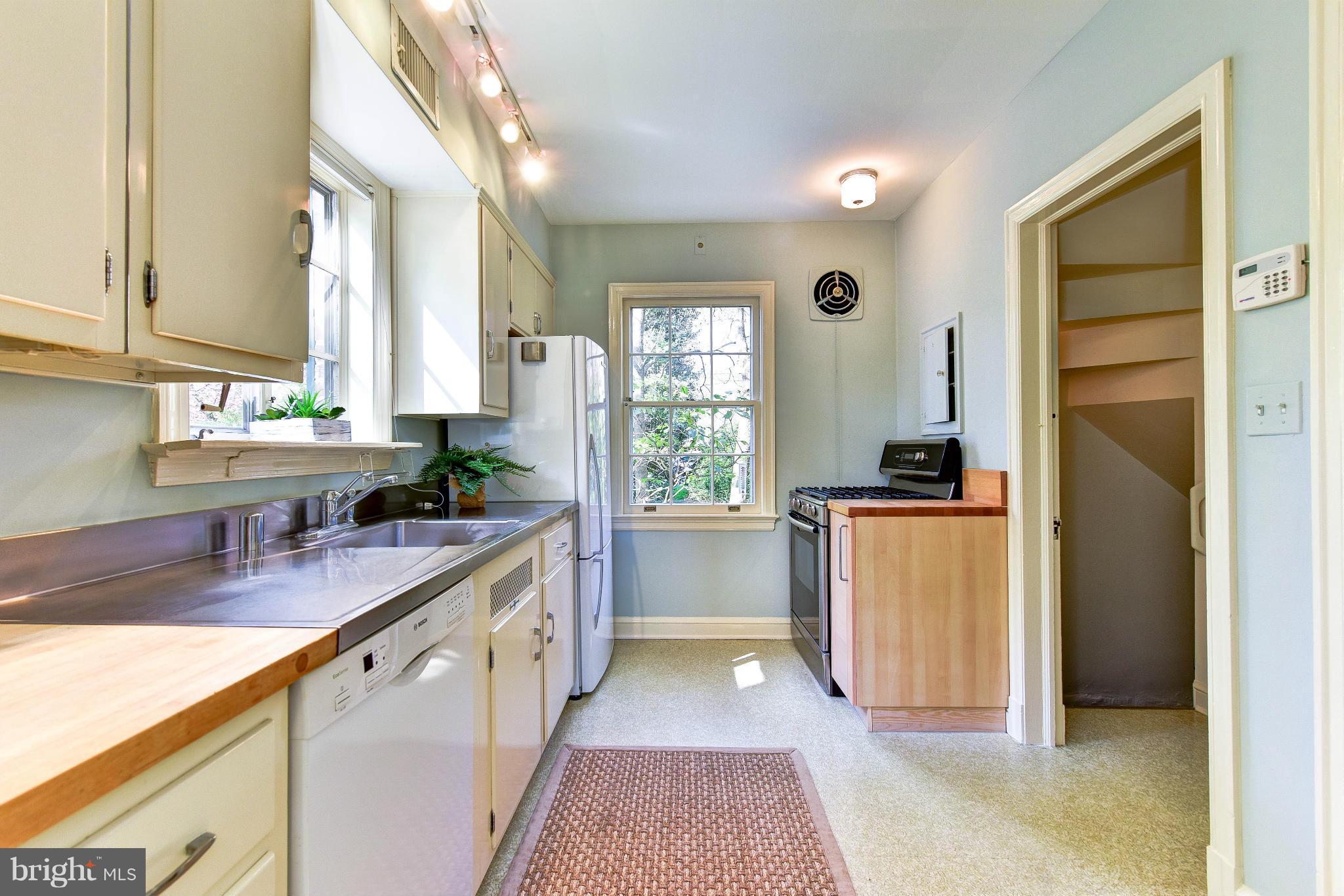 4108 Dresden Street Kensington, MD 20895 - Photo 12 of 24 a kitchen with a refrigerator and a sink