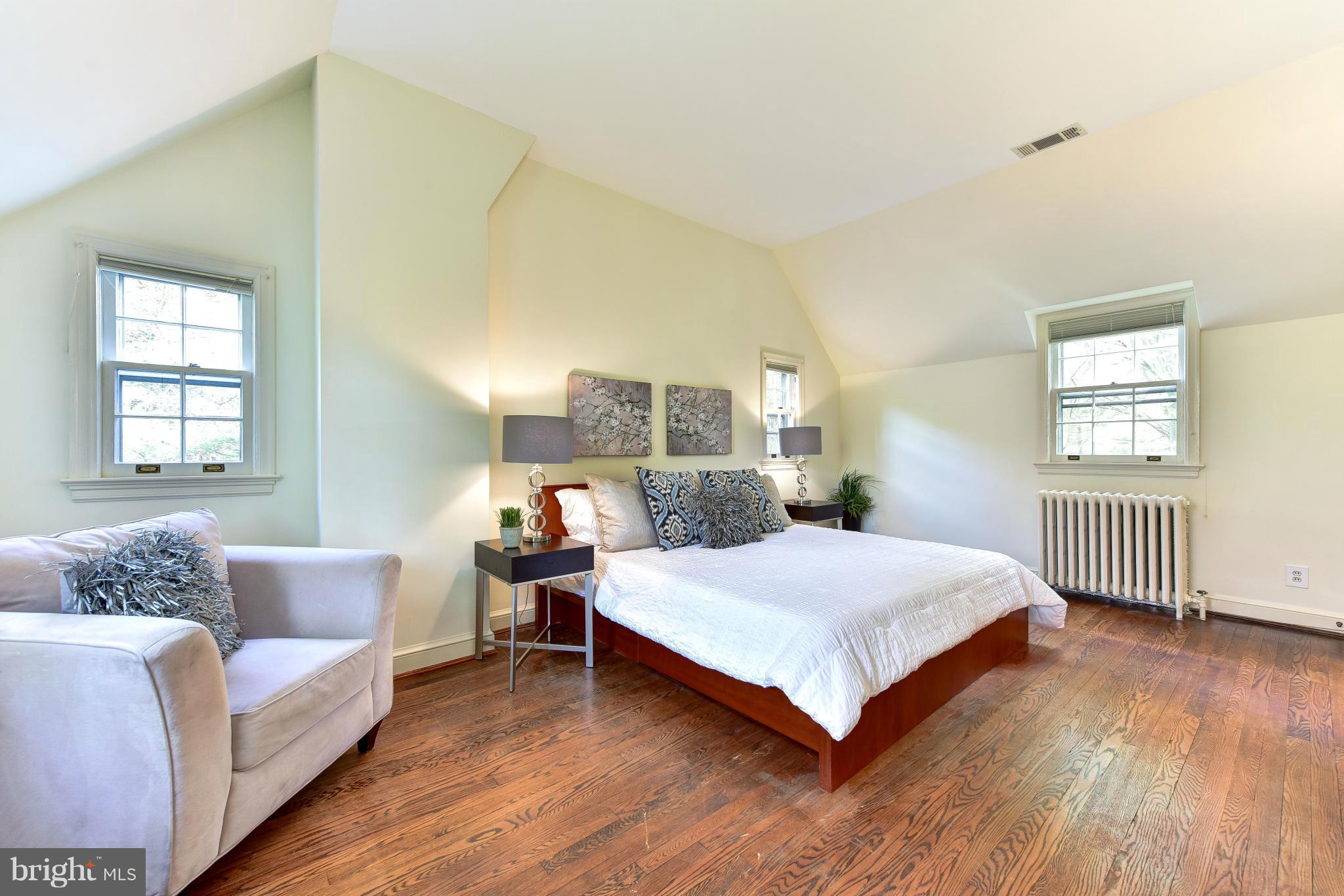 4108 Dresden Street Kensington, MD 20895 - Photo 15 of 24 a bedroom with a bed couch and a window