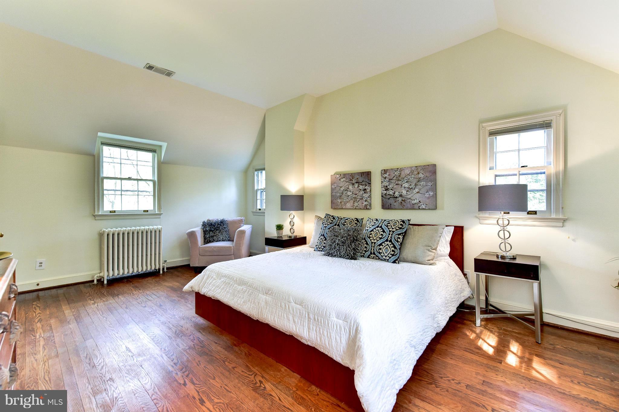 4108 Dresden Street Kensington, MD 20895 - Photo 16 of 24 a bedroom with a bed and wooden floor