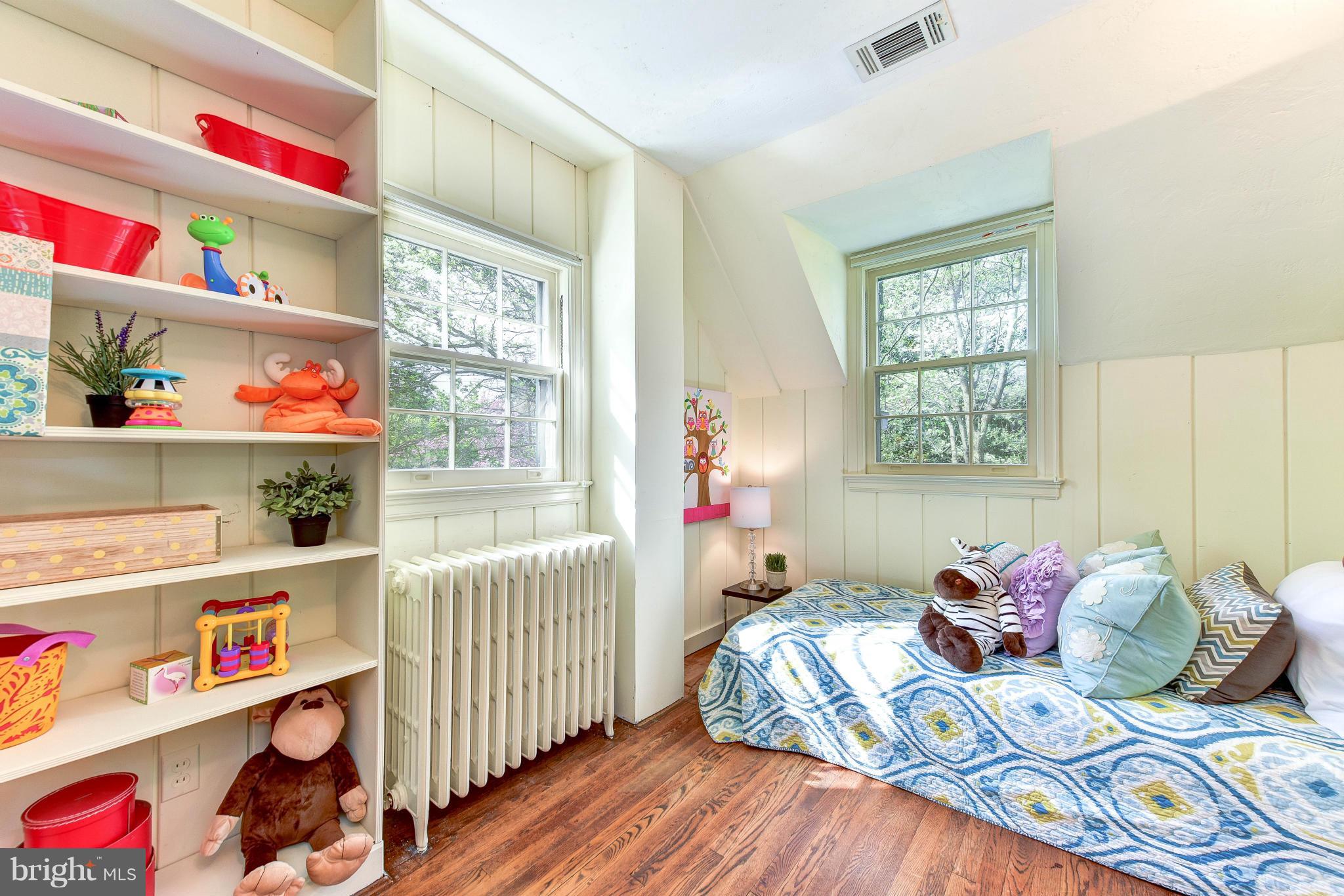 4108 Dresden Street Kensington, MD 20895 - Photo 19 of 24 a bedroom with bed and a window
