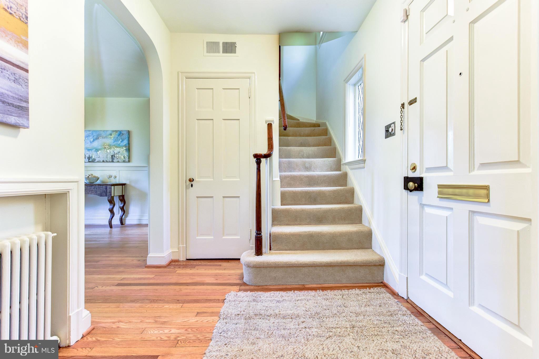 4108 Dresden Street Kensington, MD 20895 - Photo 8 of 24 a view of an entryway with wooden floor and a rug