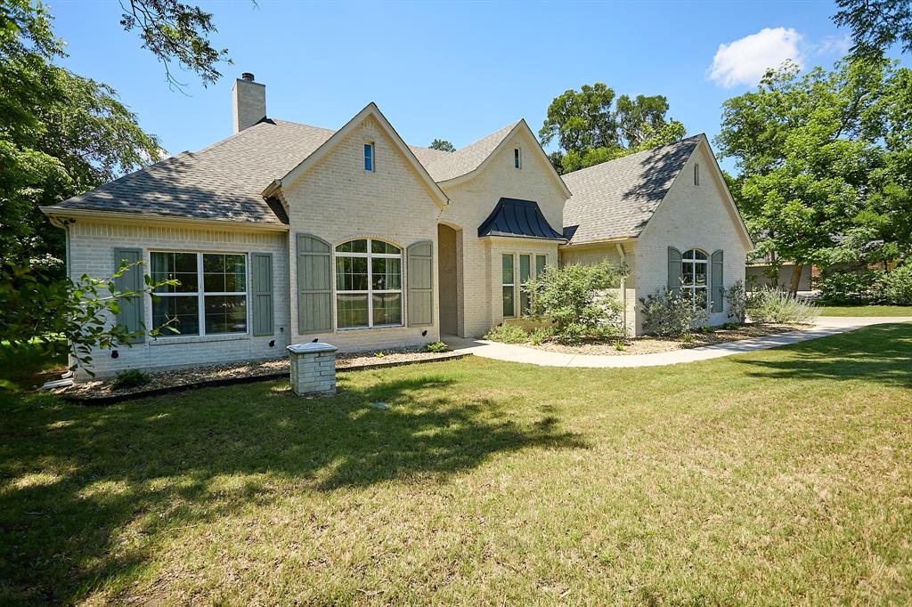 358 Glade Valley Road Azle, TX 76020 - Photo 33 of 35 Exterior featuring light-colored brick, gabled rooflines, and a covered entry