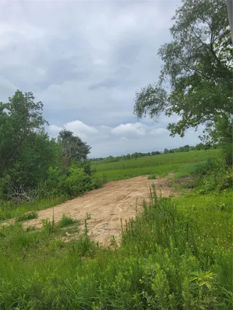 a view of a lake with a yard