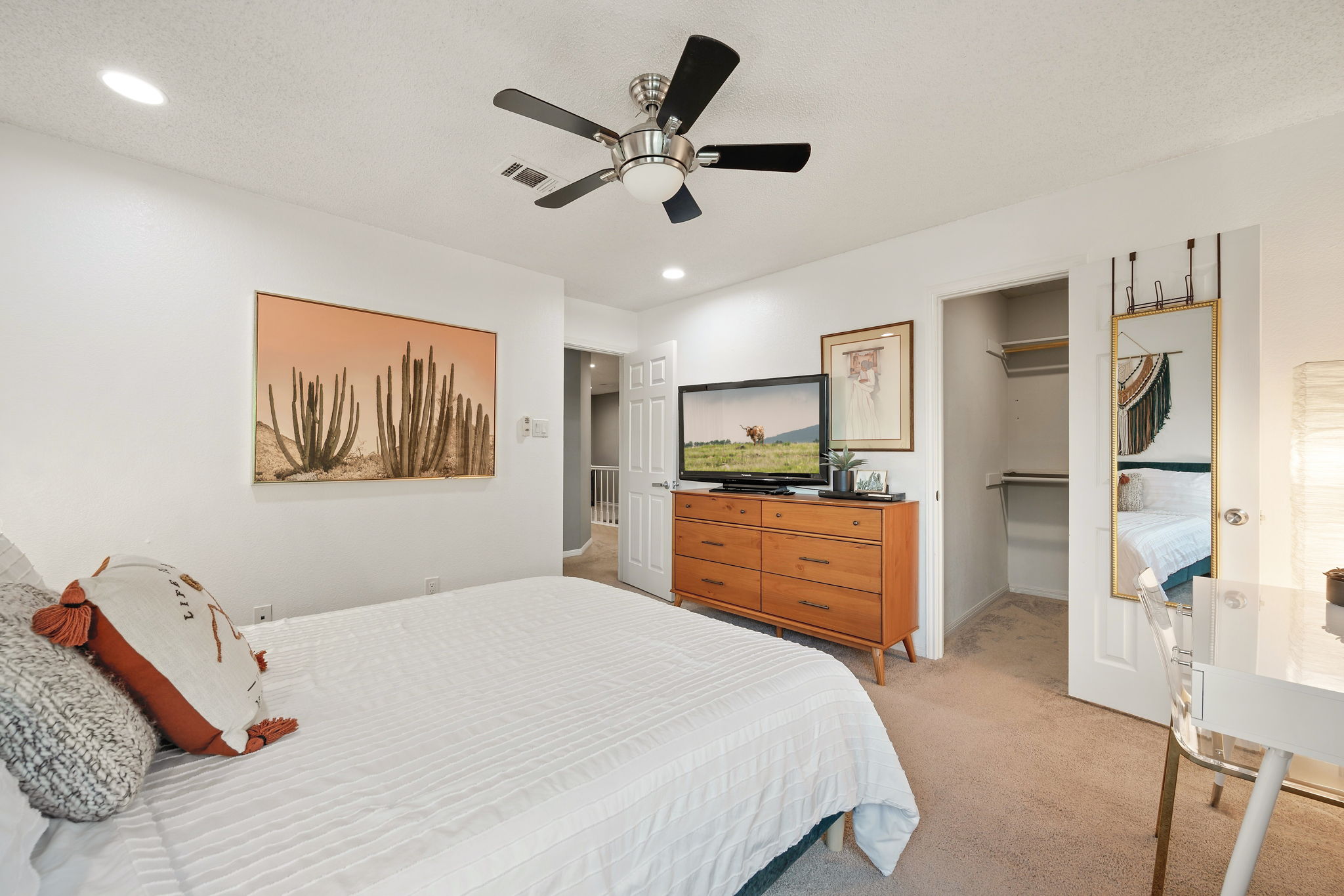 705 Canyon Bend Road Pflugerville, TX 78660 - Photo 19 of 23 a bedroom with a bed and a flat screen tv